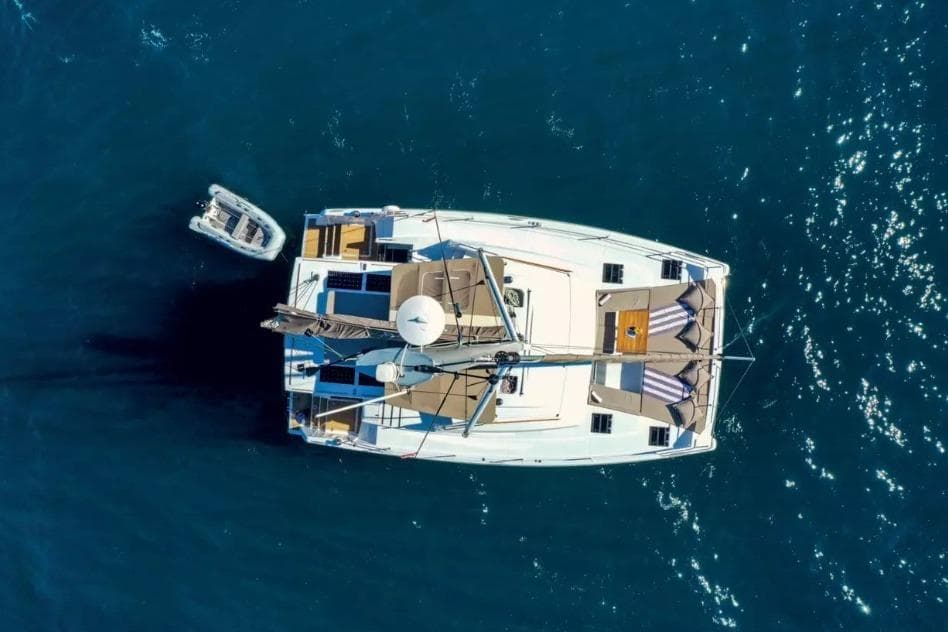 Aerial view of 2022 Bali 4.6 catamaran on blue ocean water.