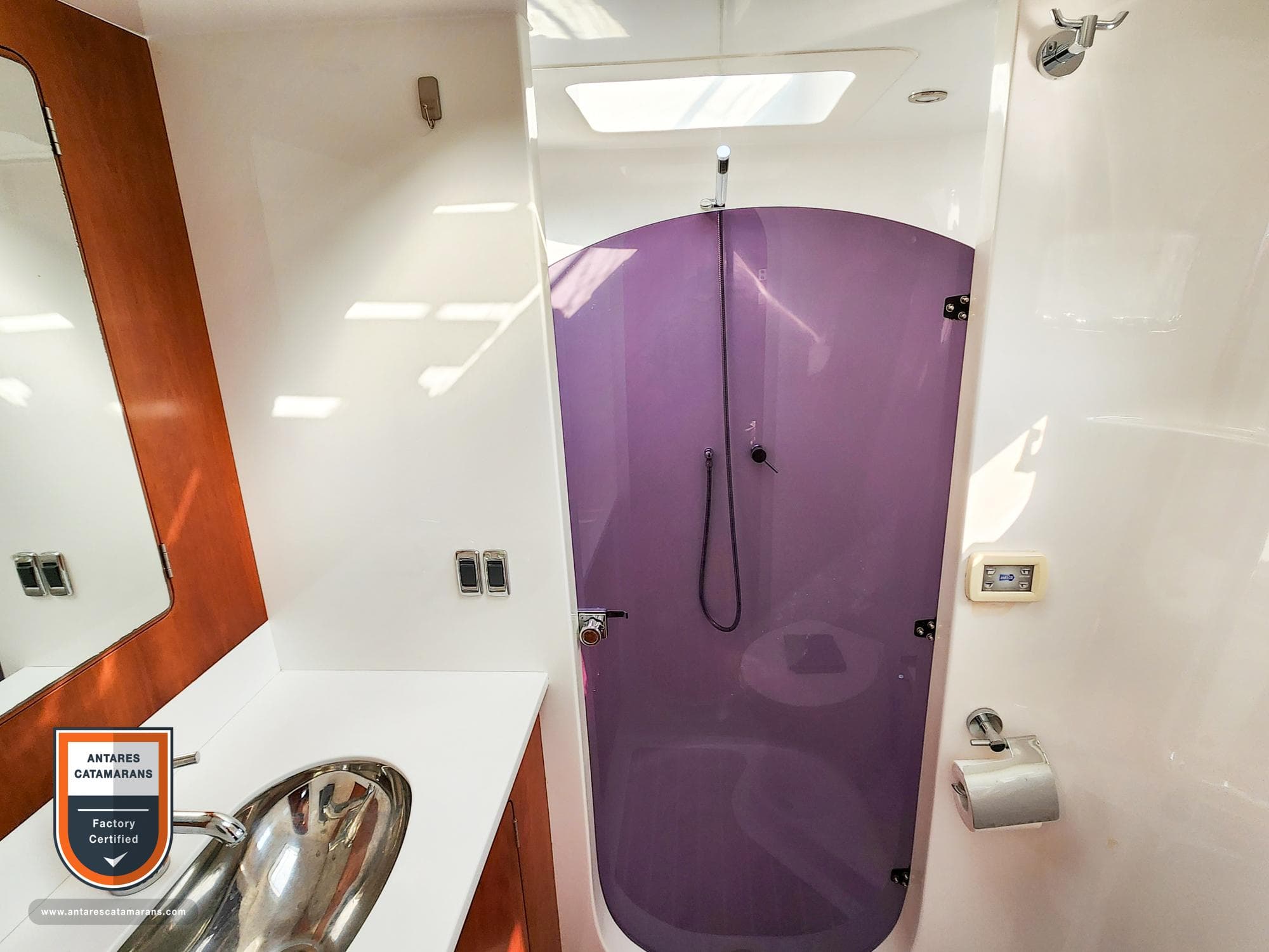 Bathroom interior of 2019 Antares 44 GT yacht with purple shower door.