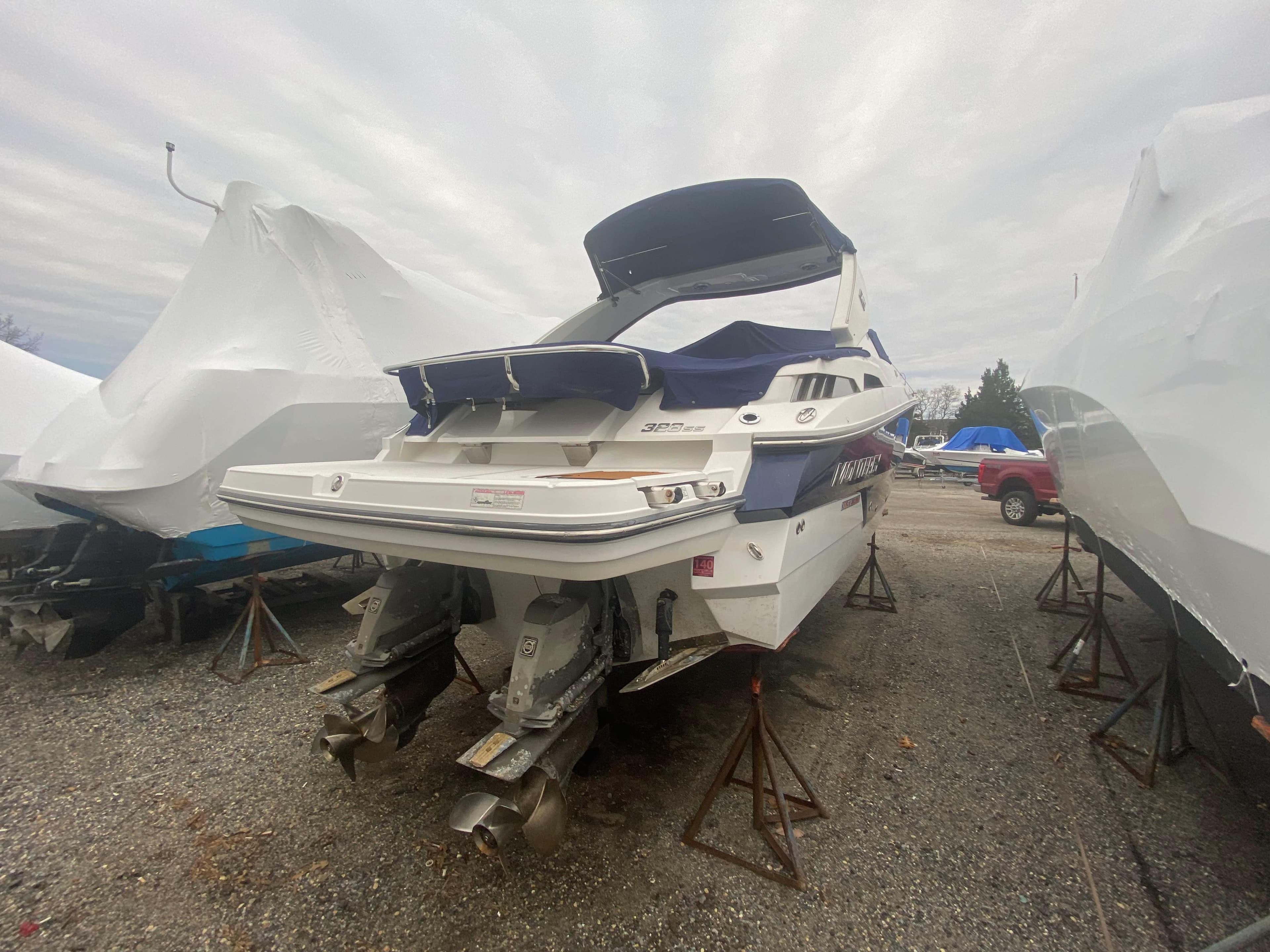 2016 Monterey 328 Super Sport boat in storage yard.