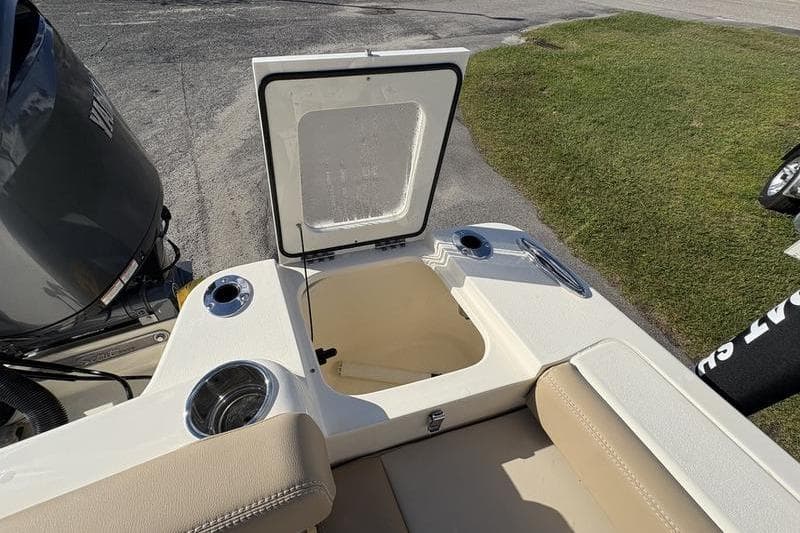 2026 Scout 222 Dorado boat interior with open storage compartment and cup holders.