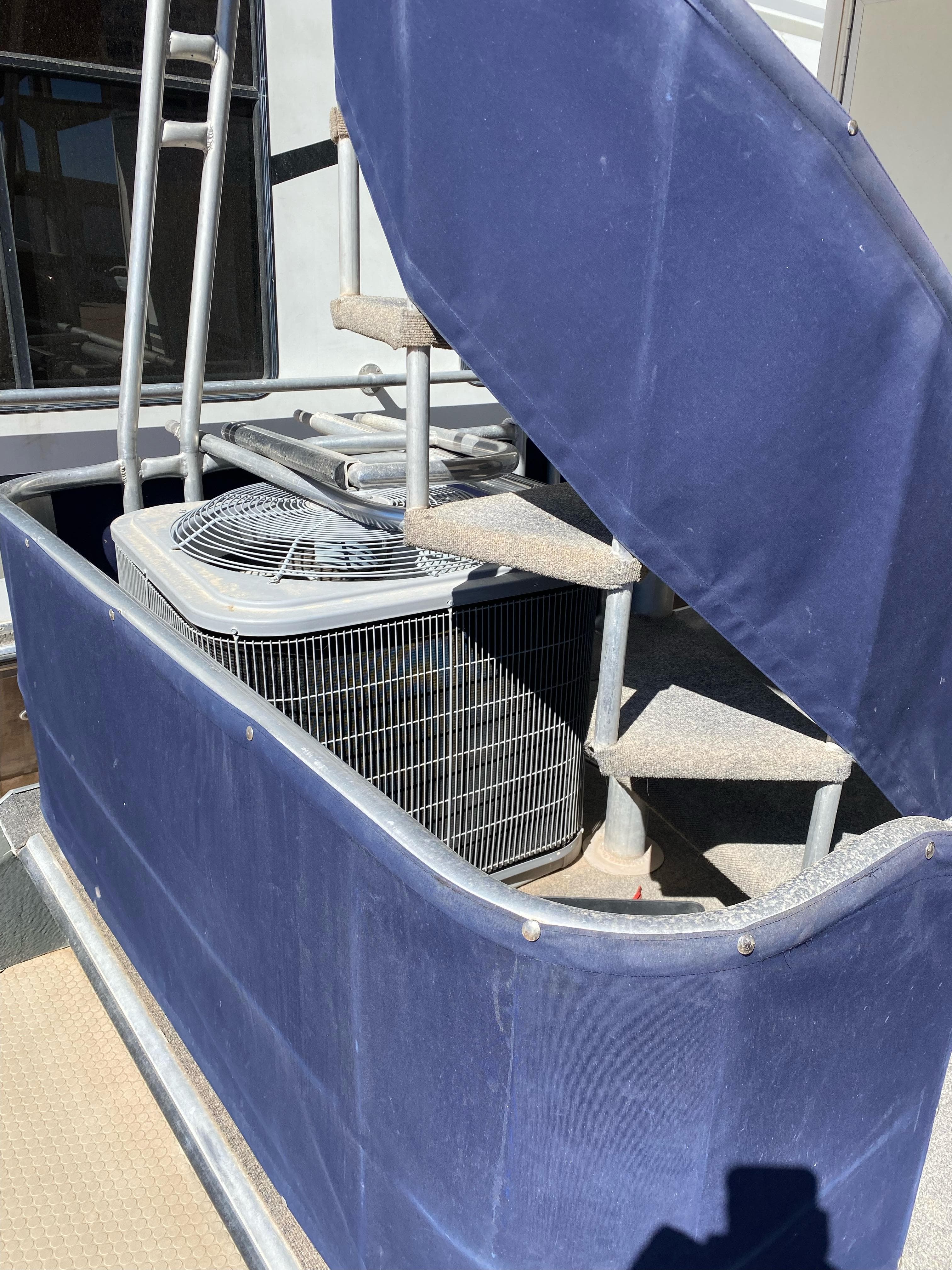 Staircase with blue fabric cover on a 2001 Stardust Cruisers Summer Dreamin' Trip.
