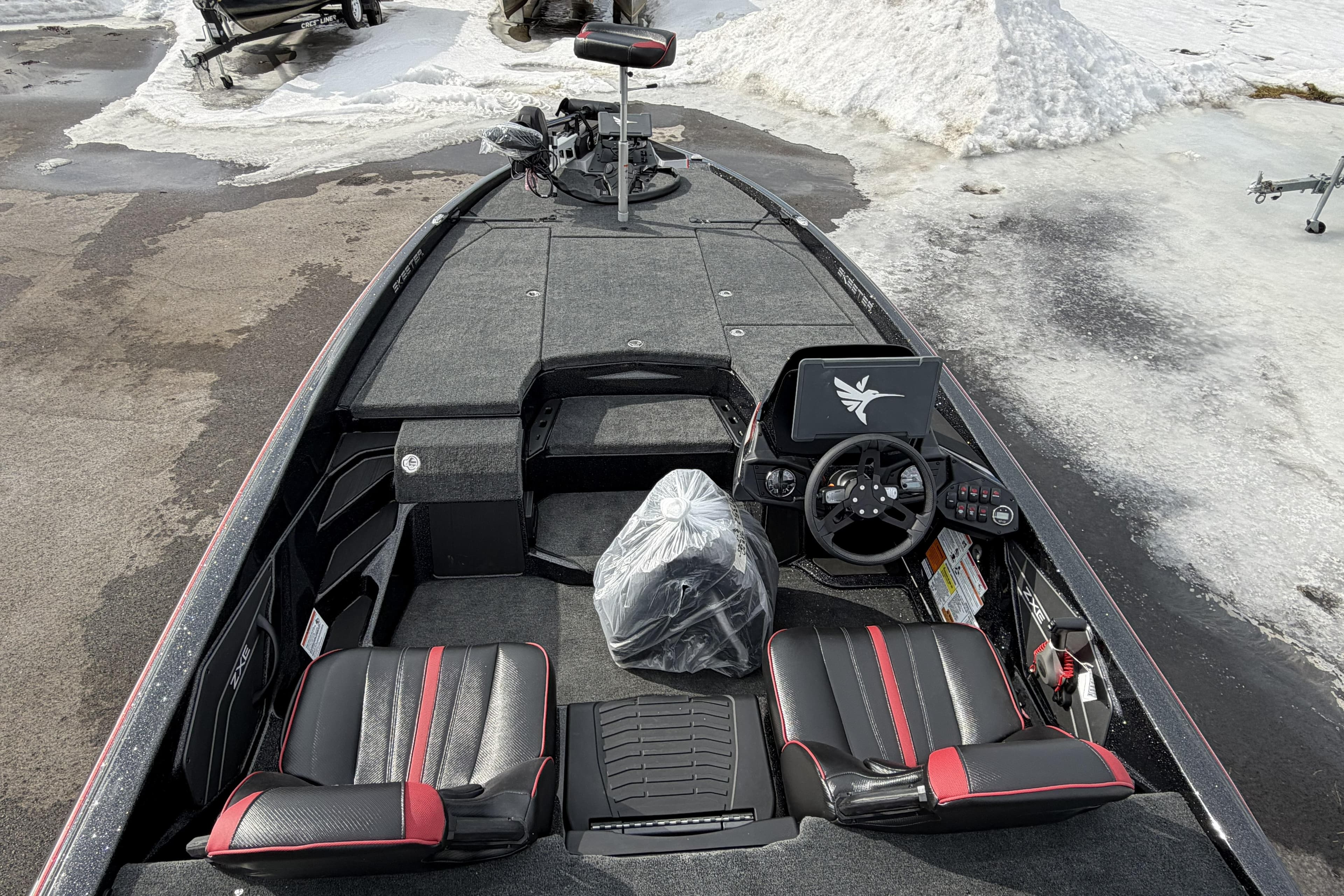 2026 Skeeter ZXE20 boat interior with dual seats, steering wheel, and control panel.