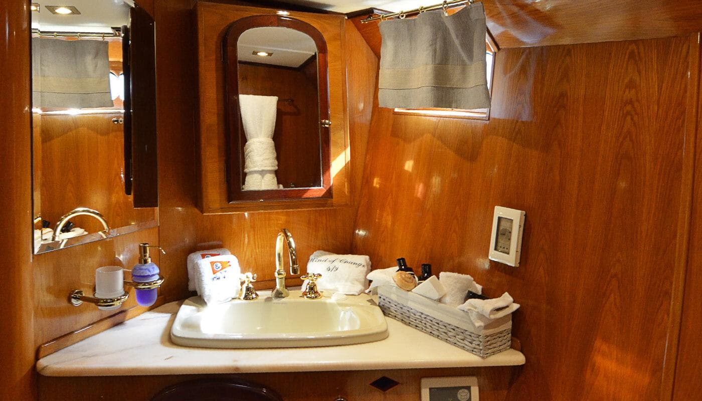 Luxurious bathroom in a 1988 Brooke Marine Motorsailer with wooden cabinetry and modern fixtures.