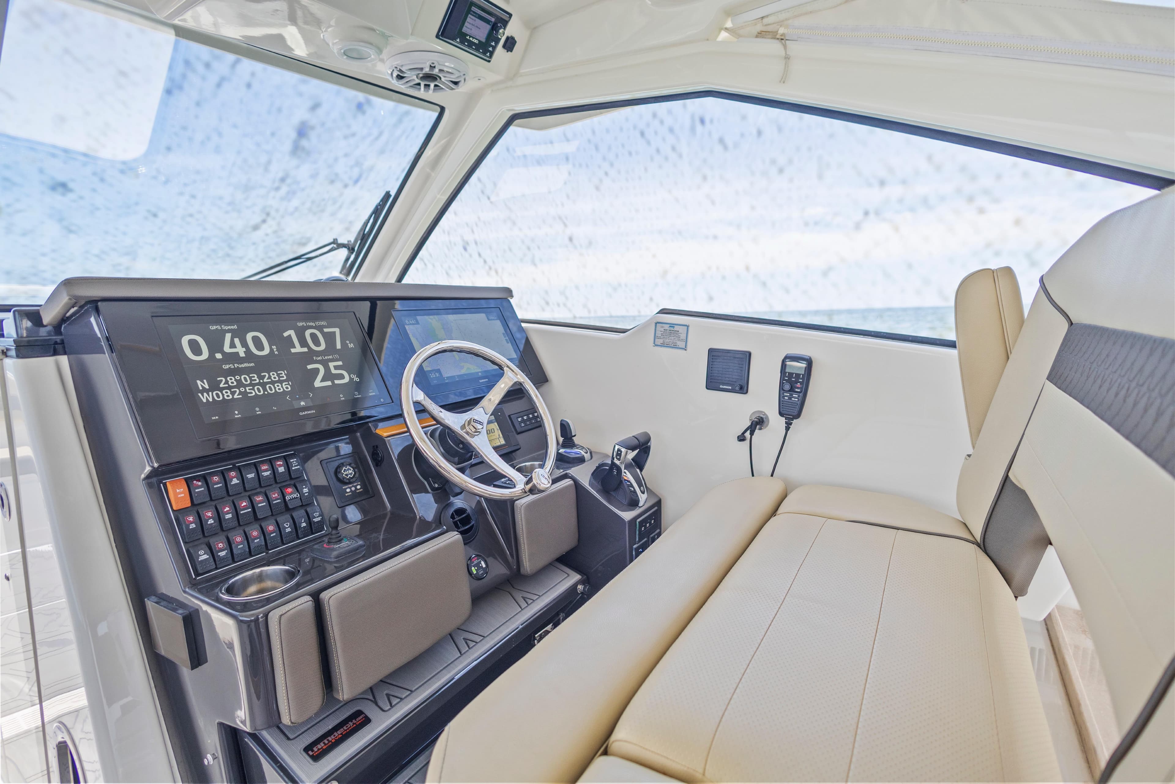 Interior cockpit of 2021 Pursuit DC 365 Dual Console boat with modern navigation controls.