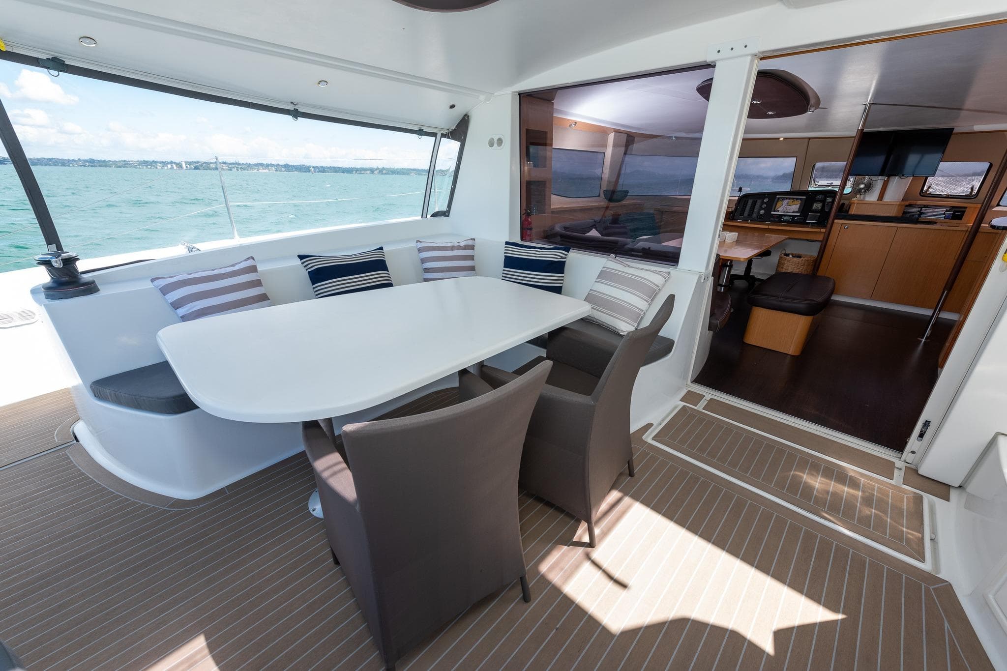 Spacious deck and interior of 2011 Fountaine Pajot Salina 48 catamaran with ocean view.