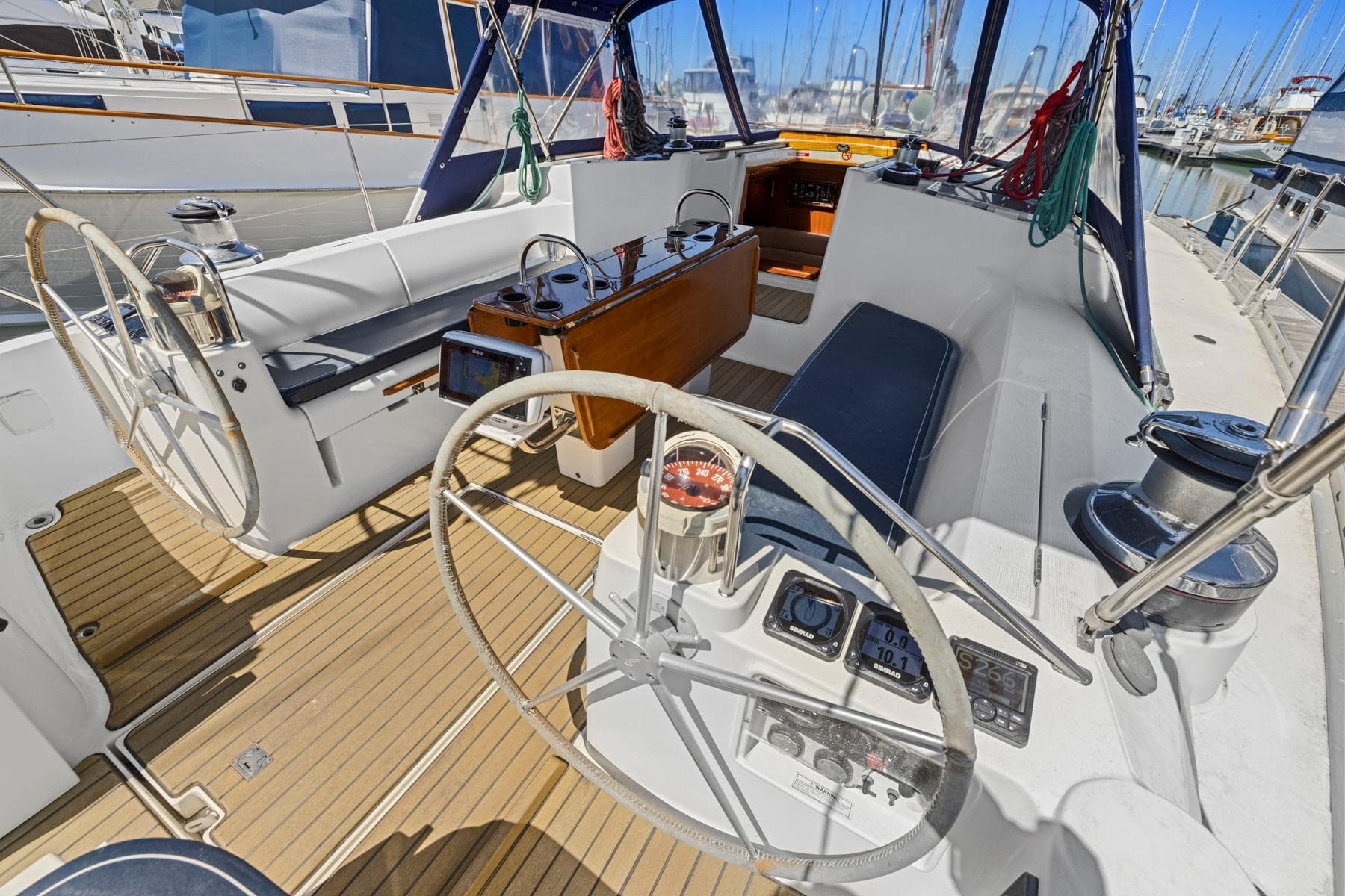Cockpit of 2001 Jeanneau Sun Odyssey 52.2 sailboat with dual steering wheels.