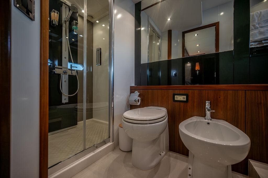 Luxurious bathroom in 2012 Sunseeker Manhattan 73 yacht with shower, toilet, and bidet.