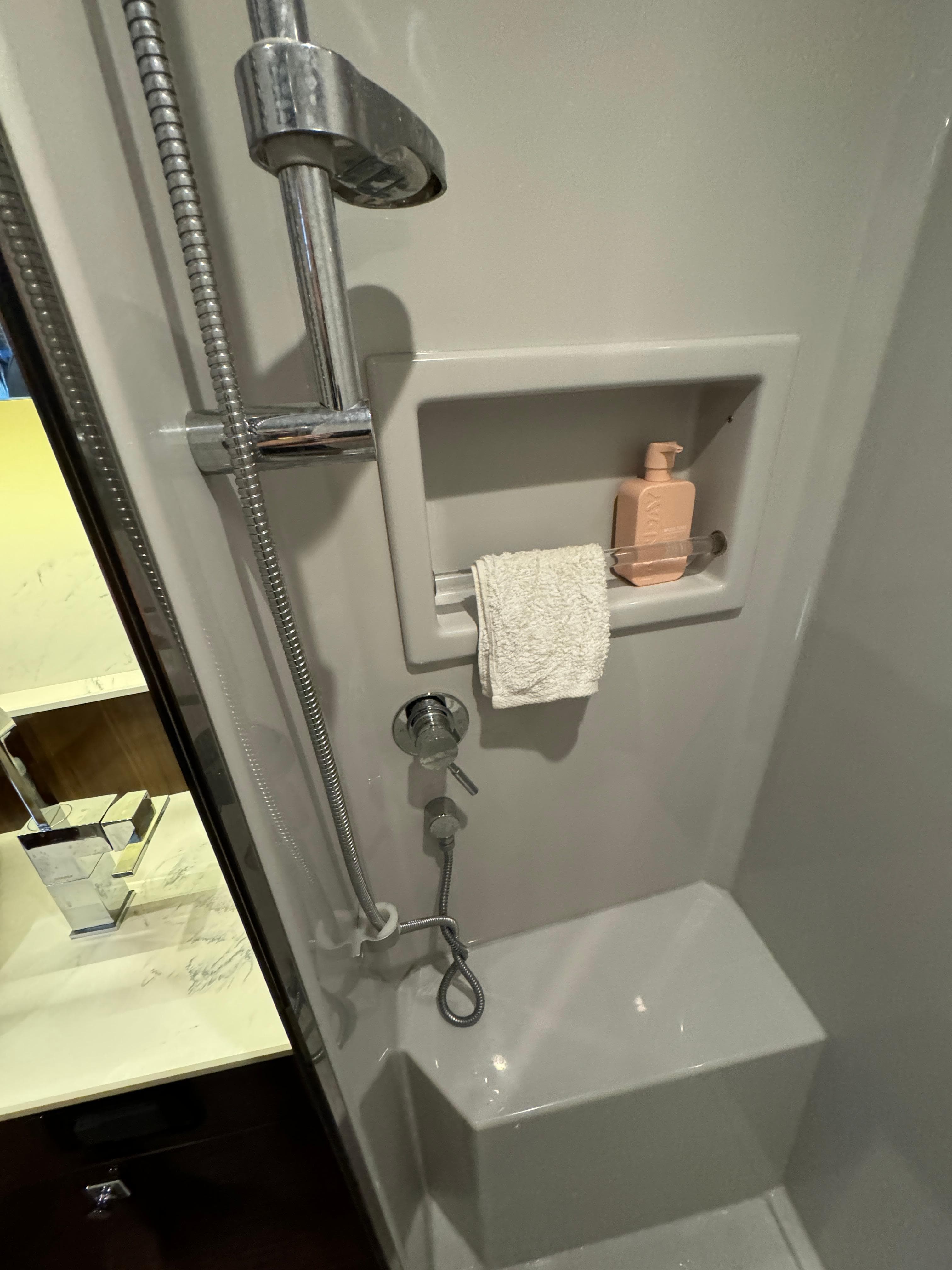 Shower area in 2023 Cruisers Yachts 46 Cantius, featuring modern fixtures and built-in shelf.
