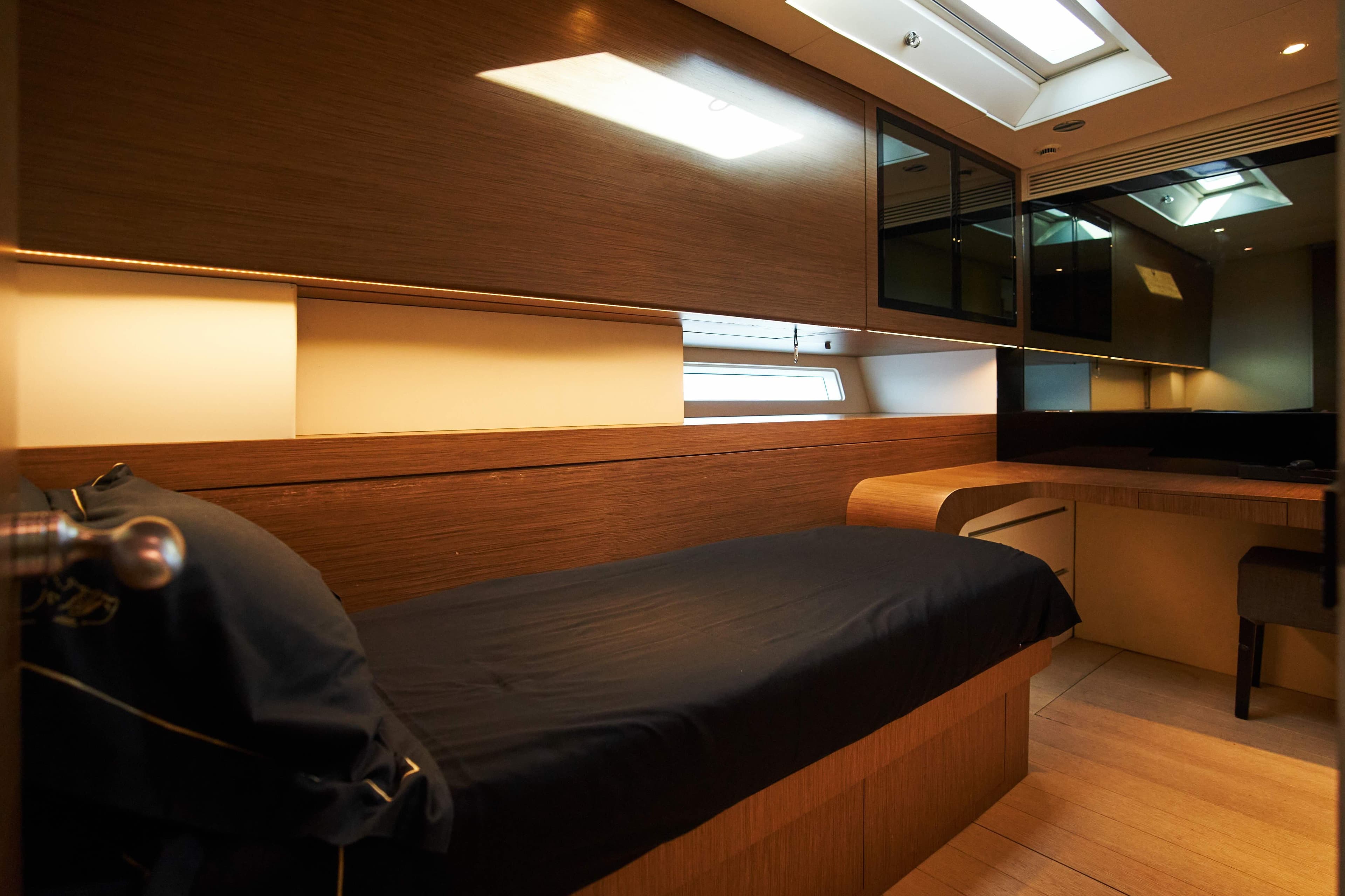 Luxurious interior of 2009 Wally 130 yacht with sleek wood finishes and modern design.