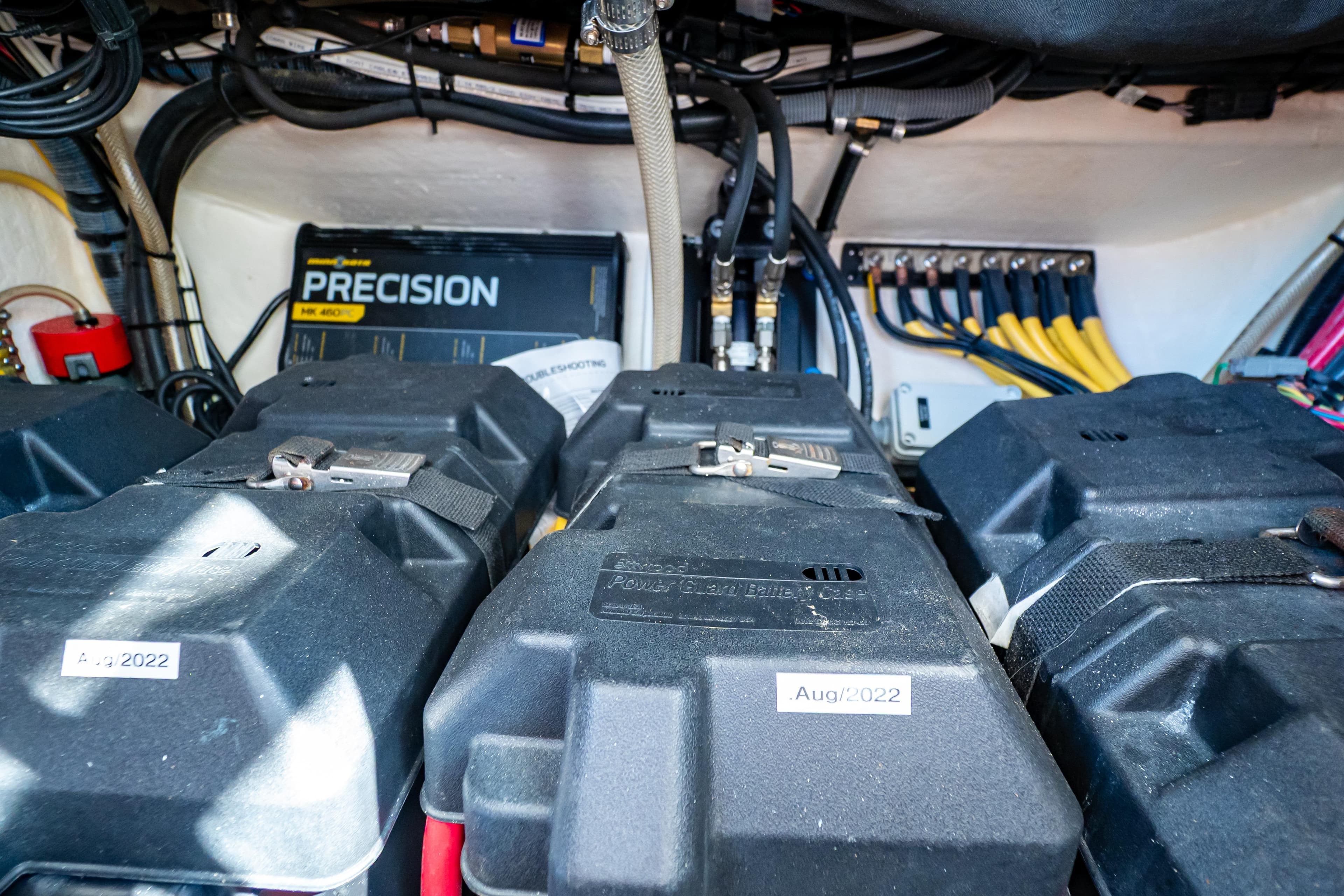 Electrical system of a 2016 Intrepid 400 Cuddy boat, featuring batteries and wiring.