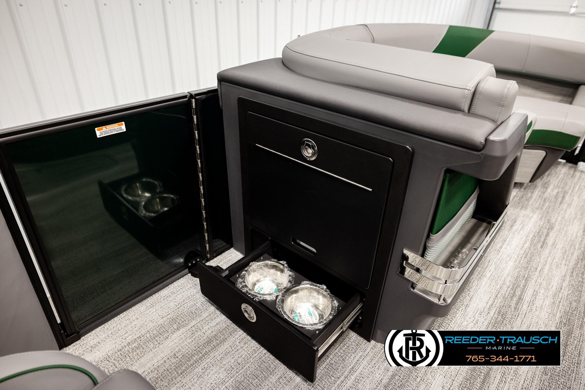 2026 Bennington MOFBSF boat interior with storage compartments and seating.