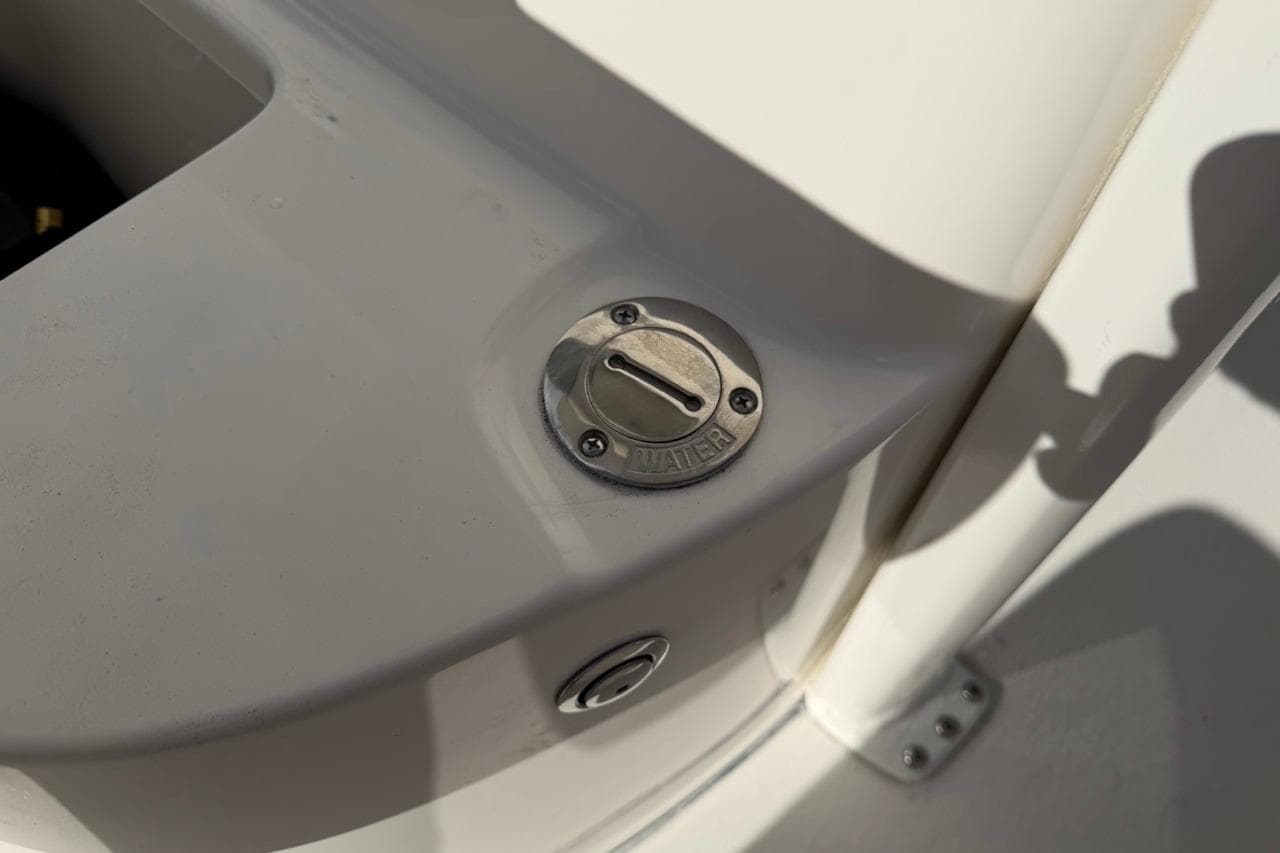Fuel cap on 2026 Key West 239 FSR boat deck in sunlight.