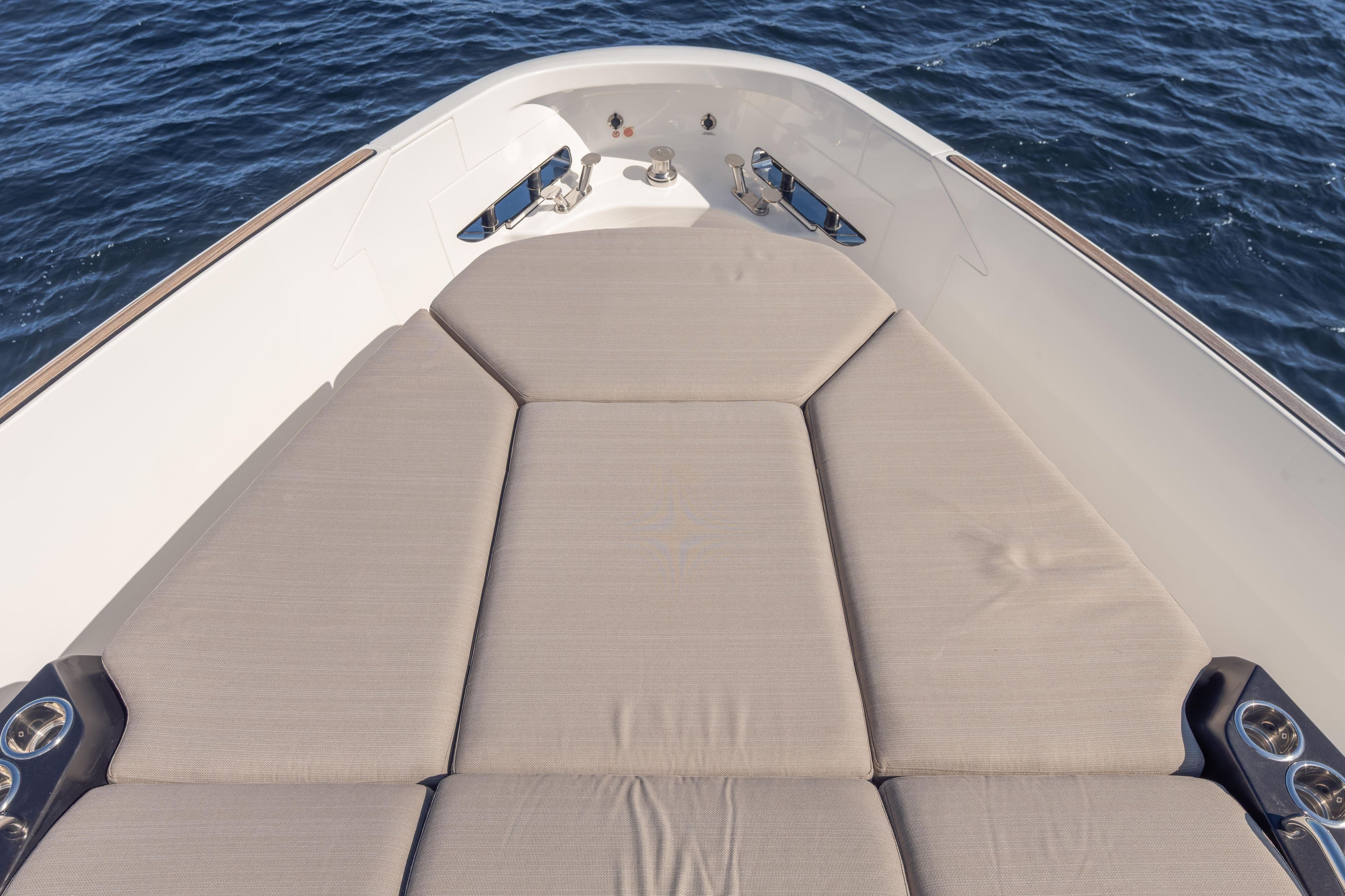 2025 Azimut Seadeck 6 yacht with spacious sunbathing deck on calm ocean waters.