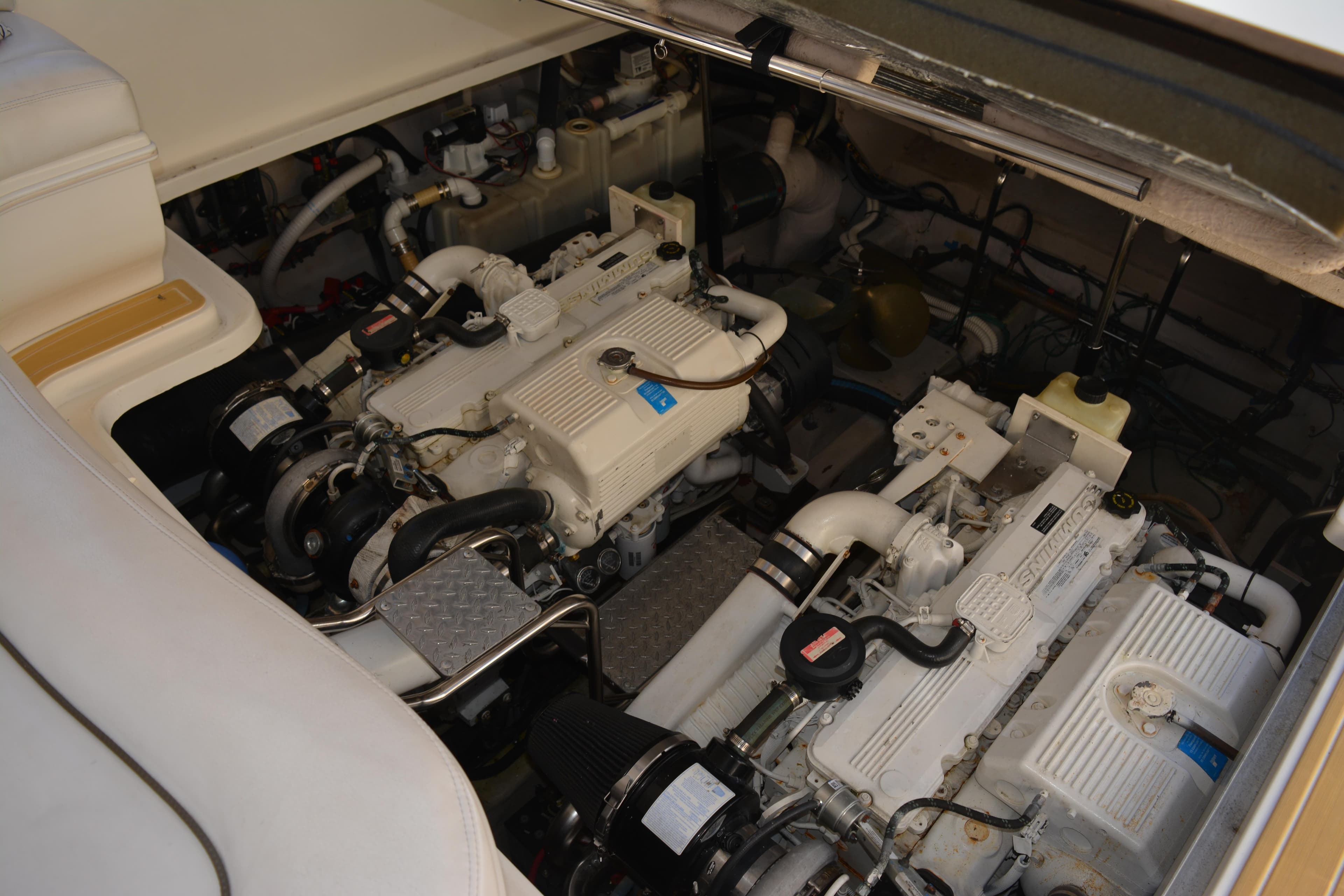 Engine room of 2007 Sea Ray 44 Sundancer yacht, showcasing dual engines and mechanical components.