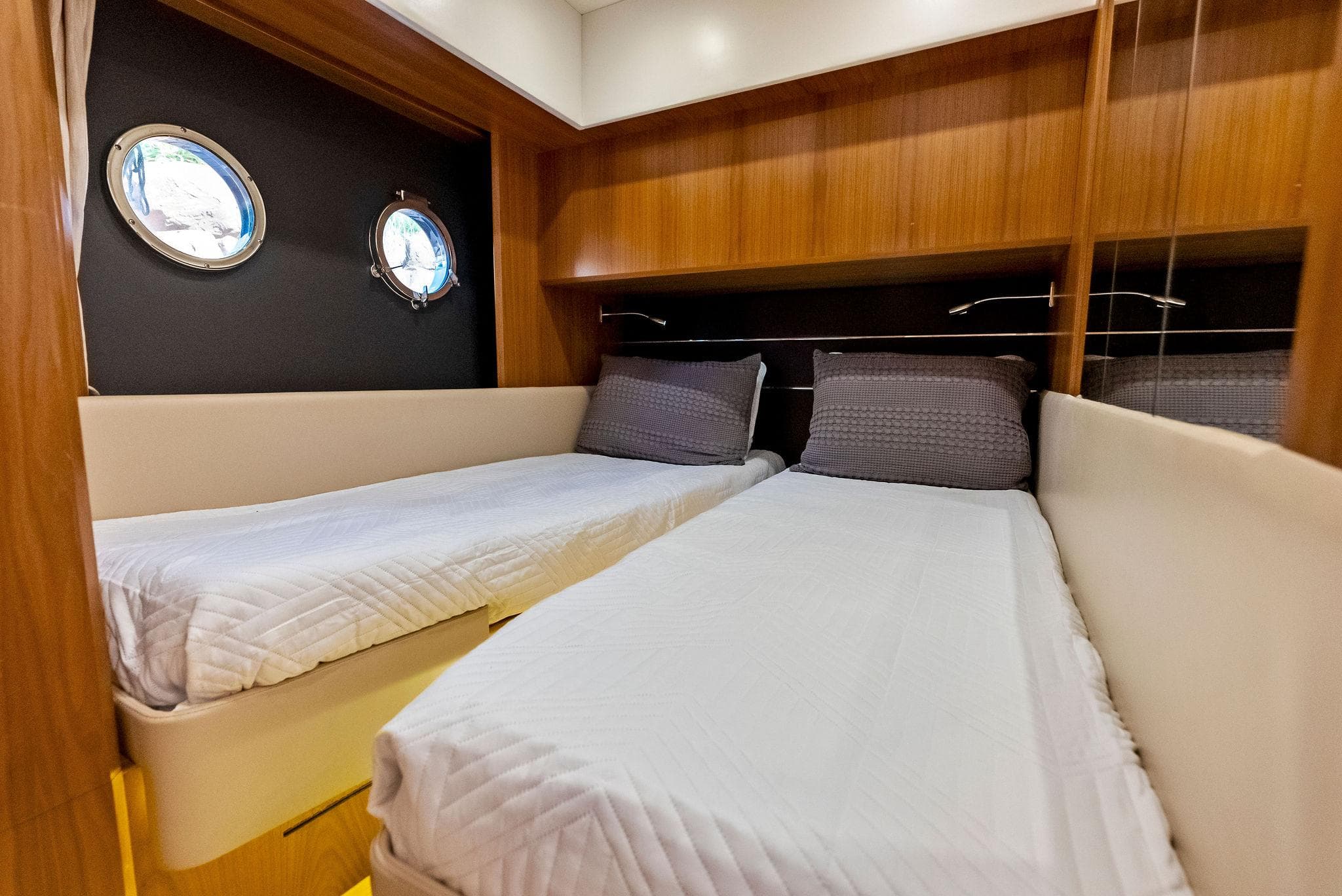 Twin cabin with portholes on 2013 Absolute 55 FLY yacht.