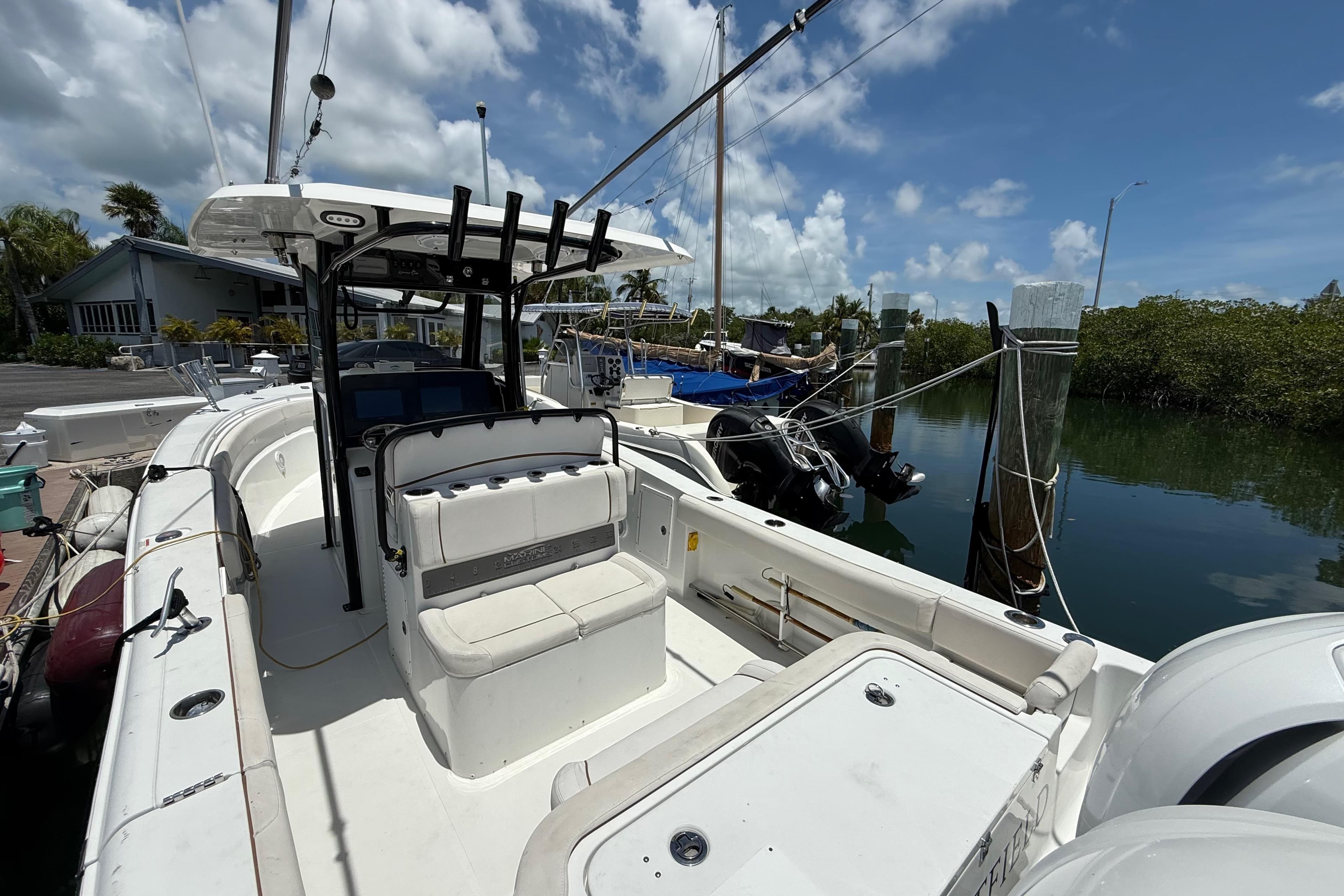 2022 Sea Hunt Gamefish 30 Coffin Box boat docked, featuring spacious seating and modern design.