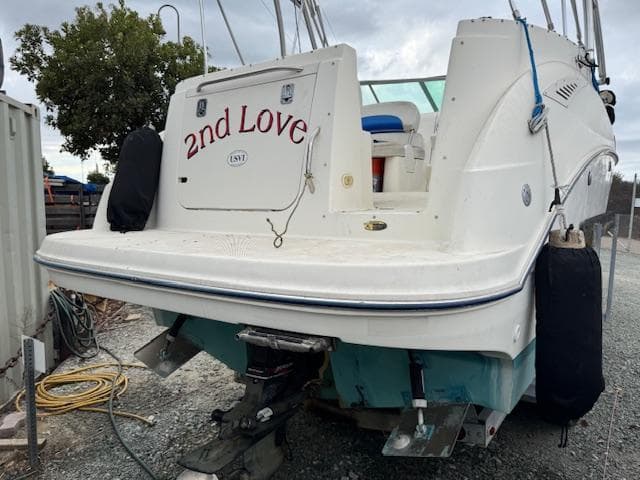 2006 Bayliner 265 SD boat named "2nd Love" on land, rear view.