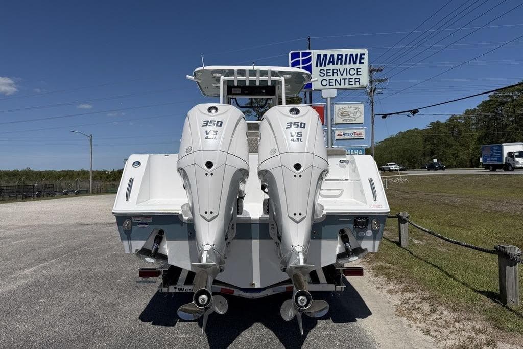2026 Sea Hunt Gamefish 30 with twin 350 V6 engines at marine service center.