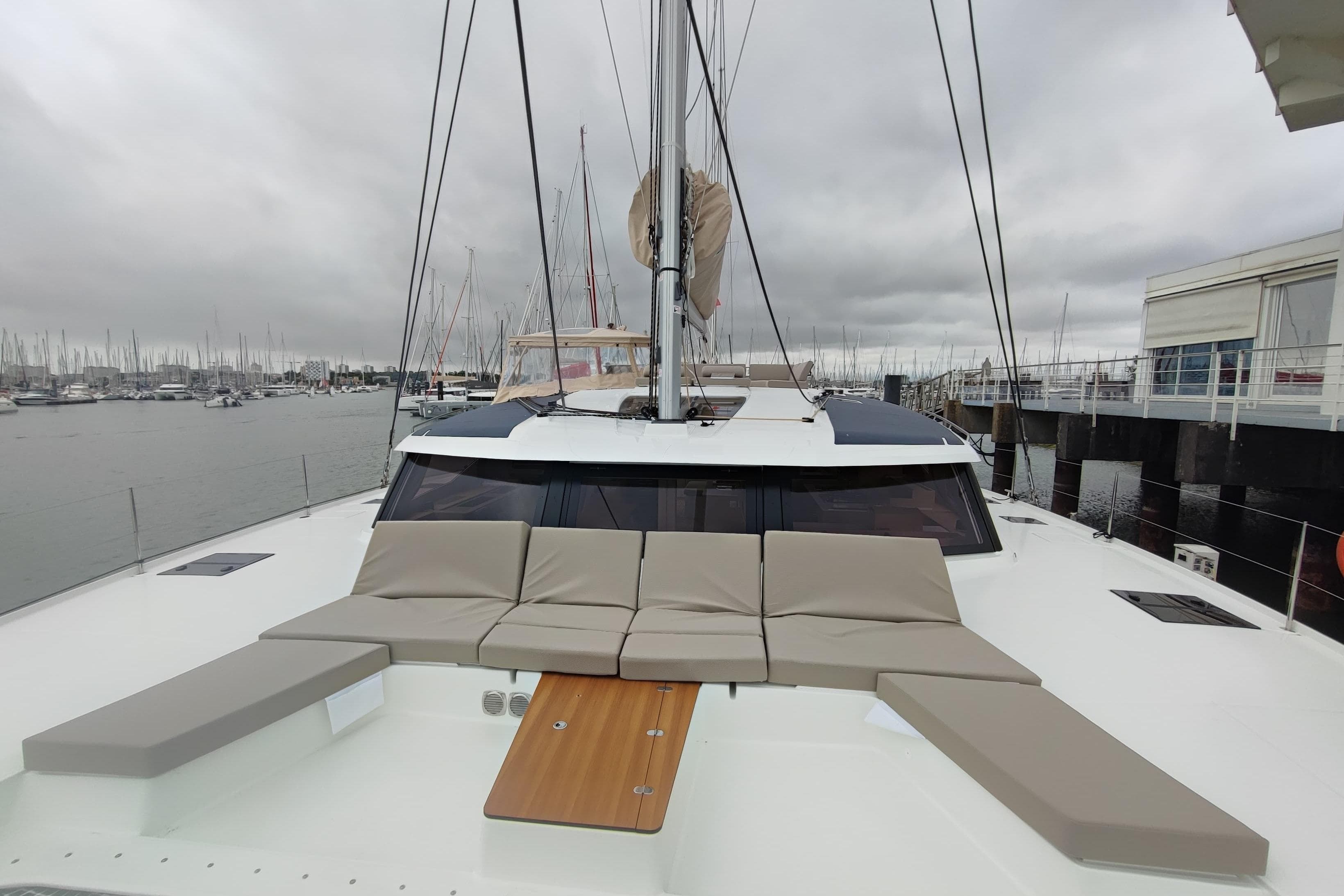 2025 Fountaine Pajot Aura 51 Catamaran with spacious deck and modern design in marina.