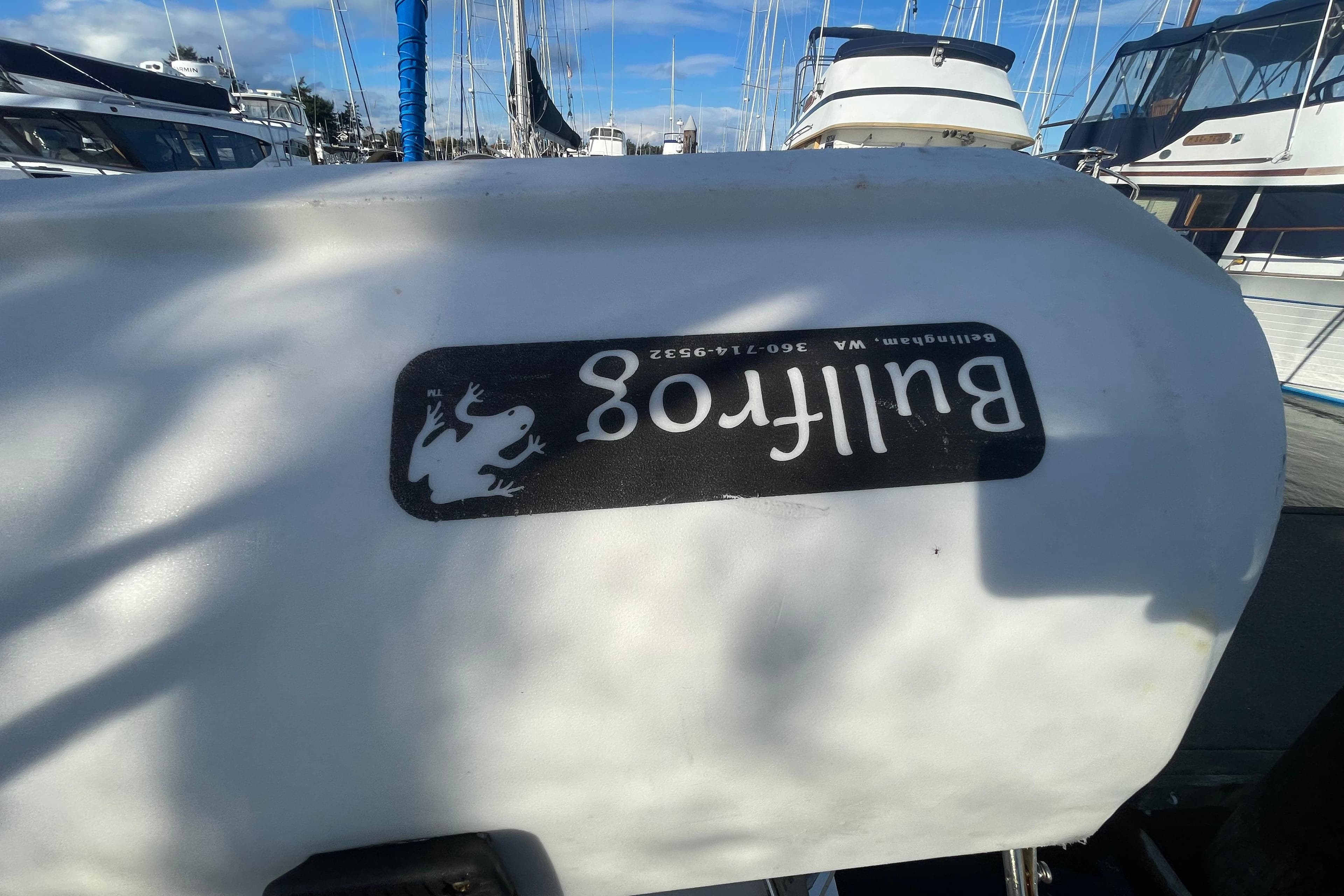 1996 Bayliner 4087 Aft Cabin Motoryacht with "Bullfrog" logo, docked at marina.