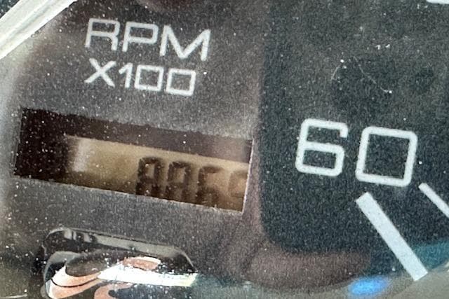Close-up of a 2001 Sea Ray 380 Sundancer RPM gauge displaying 806 RPM.