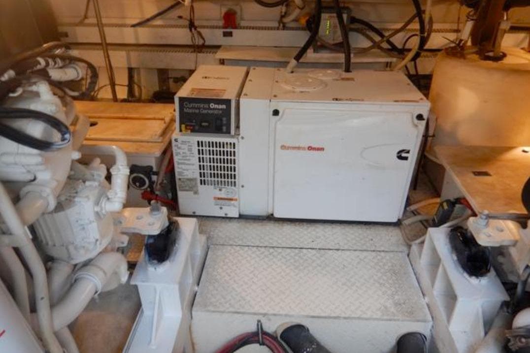 Engine room of 2008 Cruisers Yachts 560 Express with Cummins Onan marine generator.
