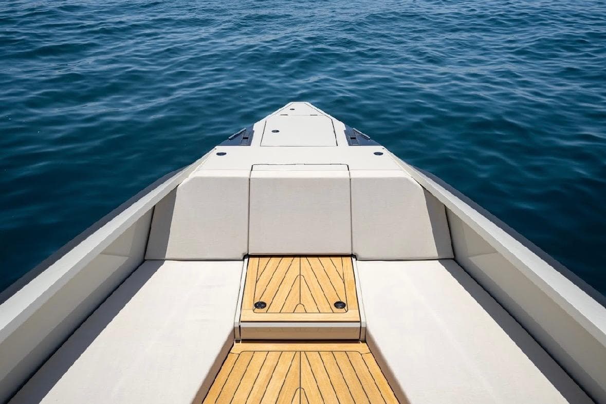 Bow view of 2025 Maori 54ft XL yacht on calm blue sea.