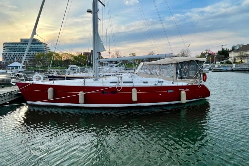 2005 Beneteau Oceanis Clipper 423 sailboat docked at marina during sunset.
