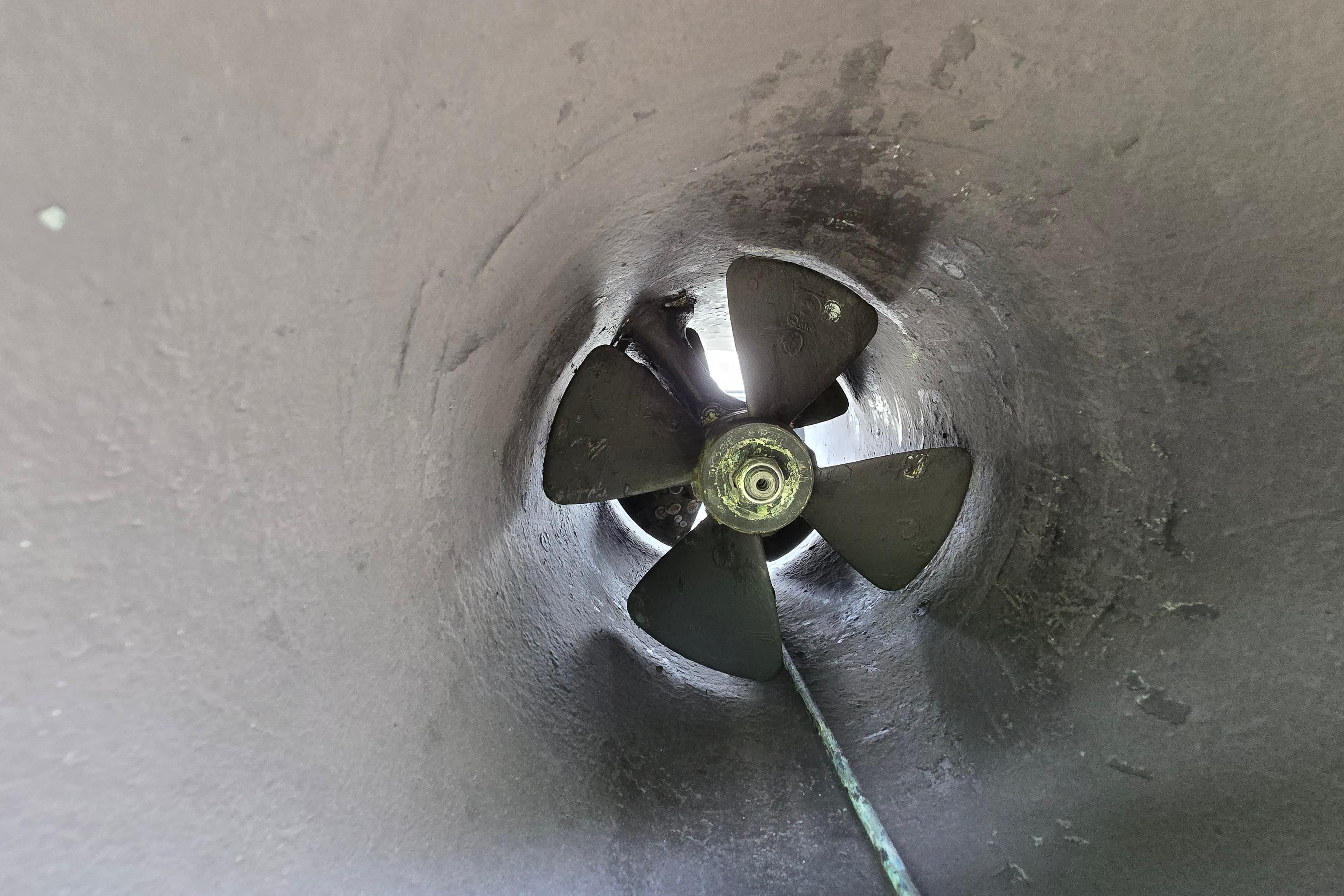 Bow thruster of a 1980 Hatteras 70 Motor Yacht, showcasing propeller detail.