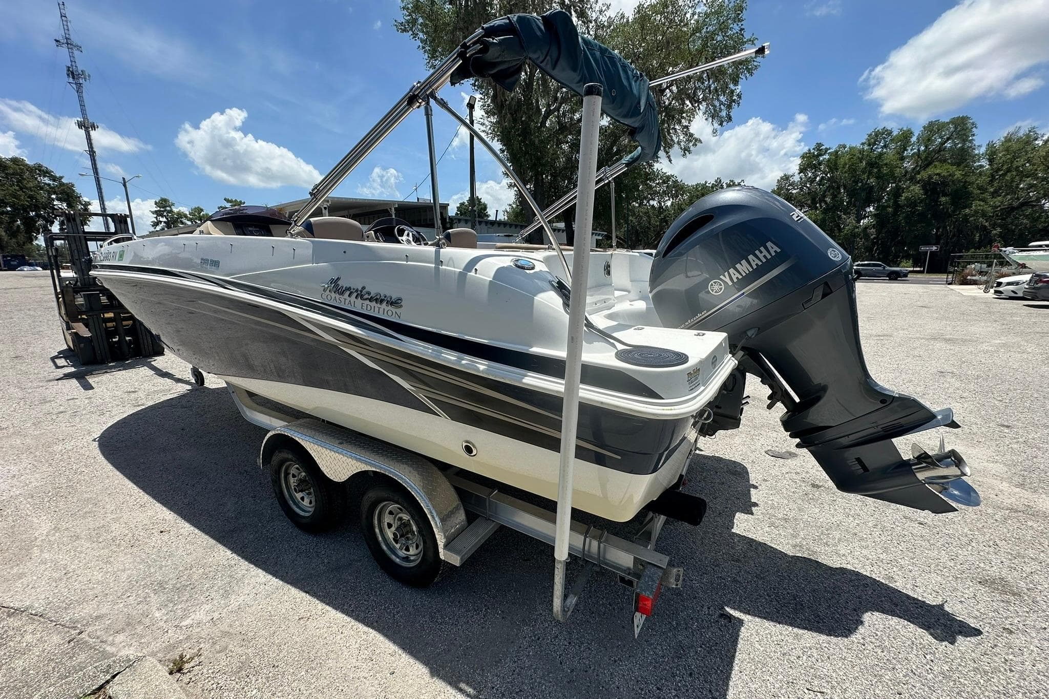 2019 Hurricane Sundeck Sport 218 OB boat with Yamaha outboard motor on trailer.