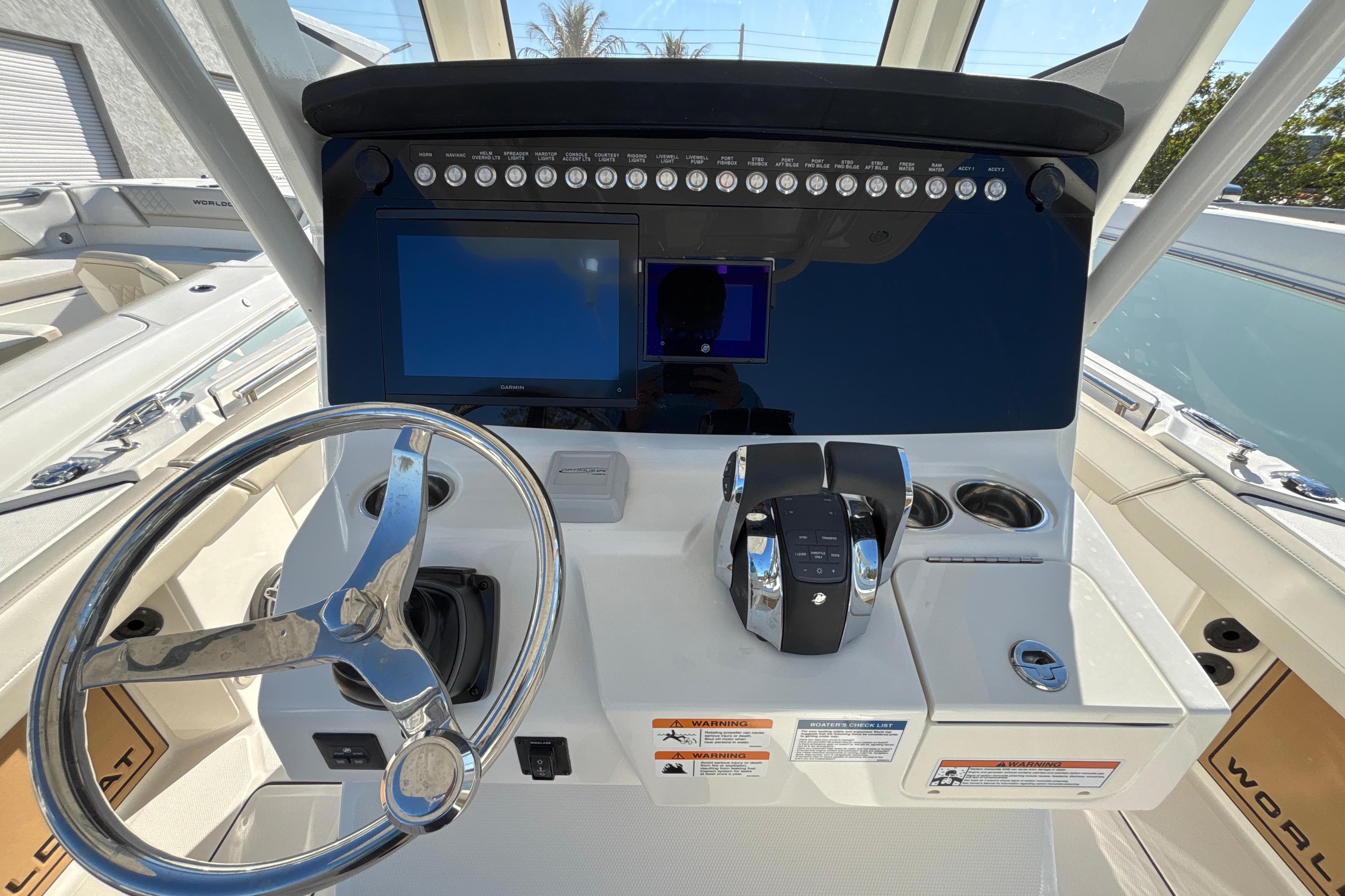 2026 World Cat 265 CC-X boat dashboard with steering wheel and control panel.