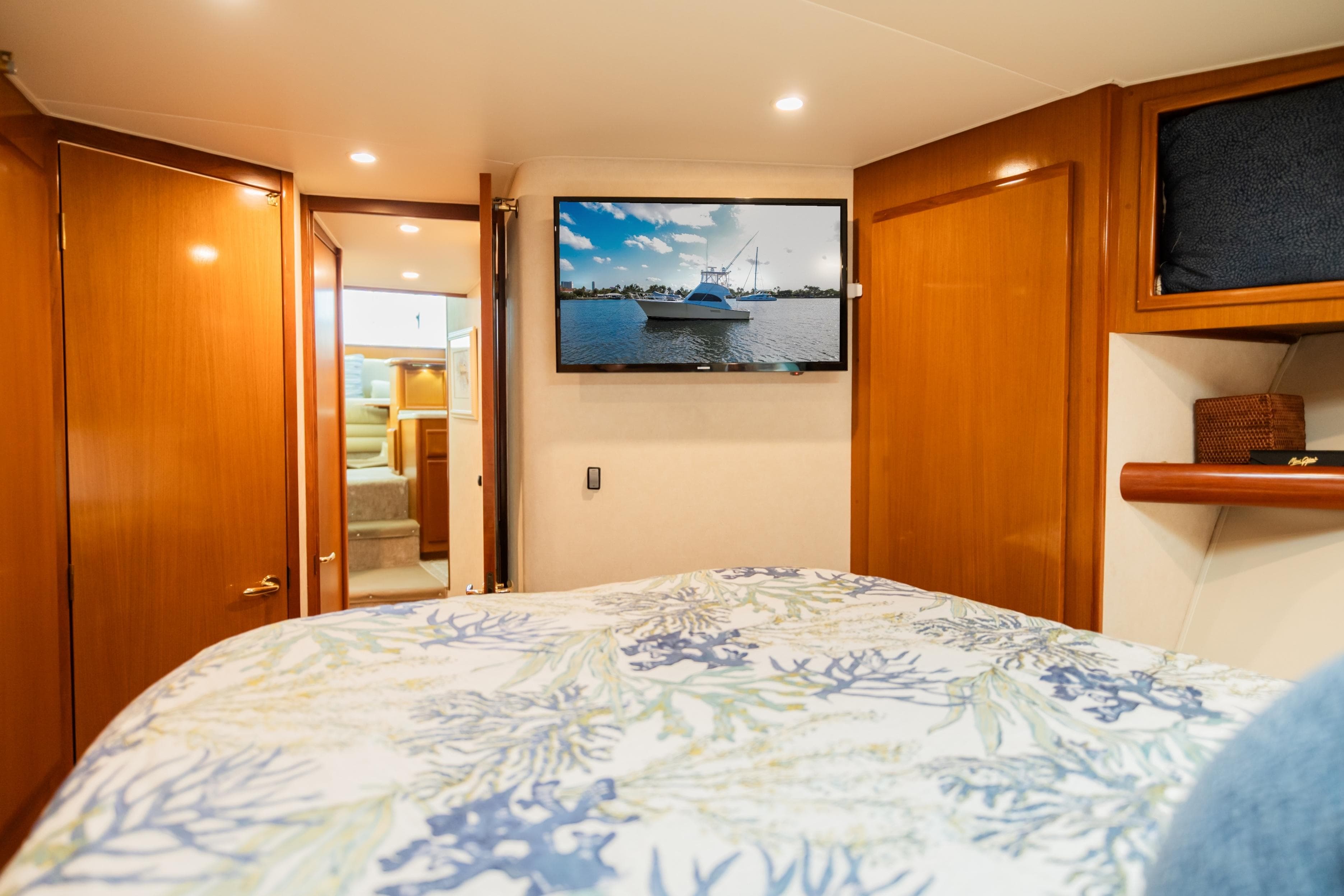 Luxurious cabin interior of 2008 Post 42 yacht with TV and wooden finishes.