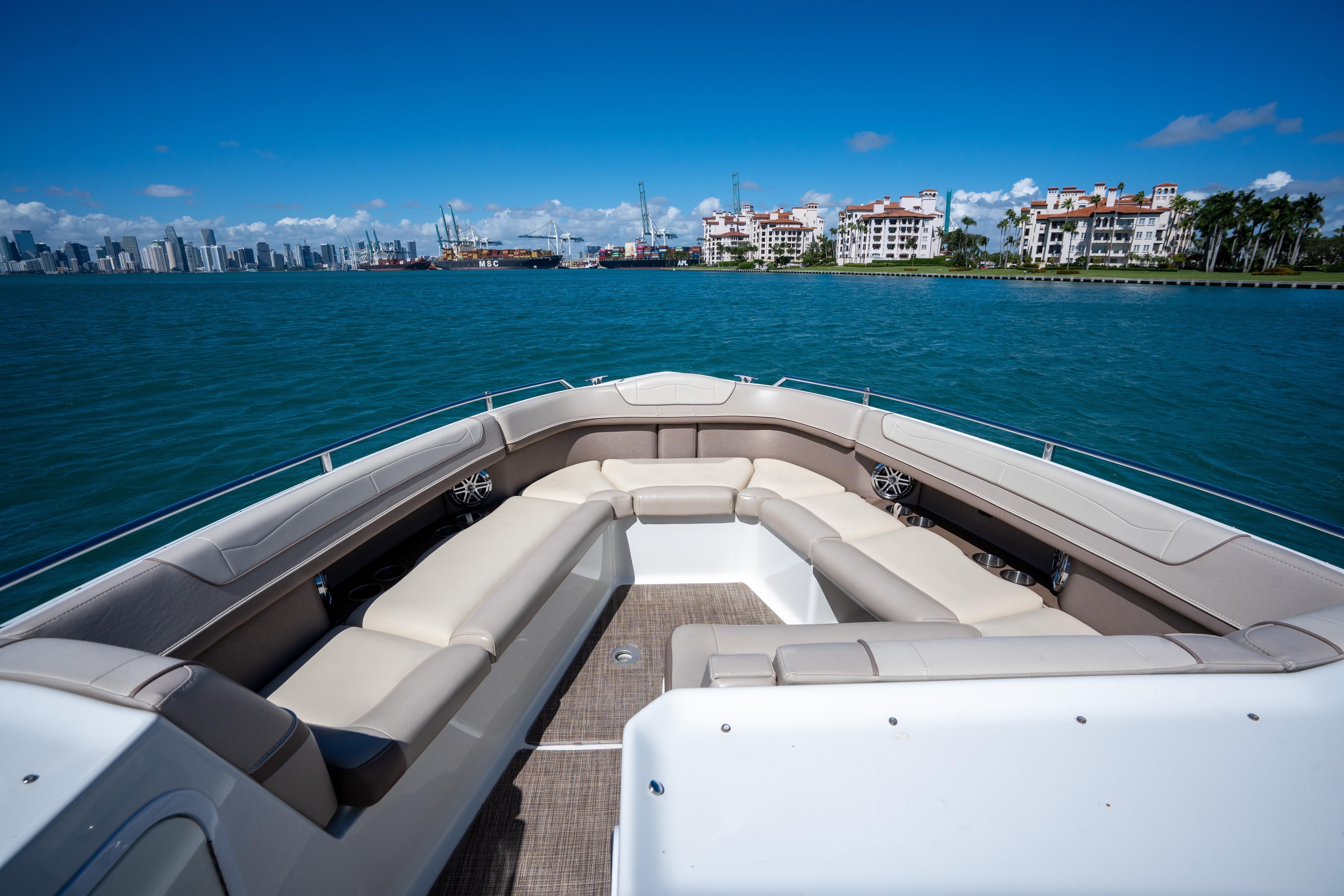 2018 Formula 350 Crossover Bowrider OB on water, city skyline in background.