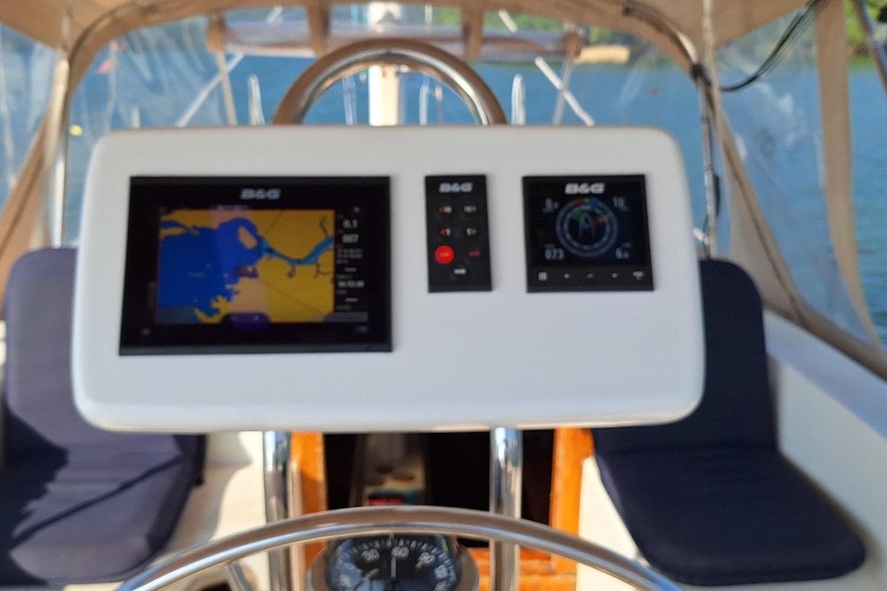 Cockpit of 1985 Gulfstar Hirsch 45 CC sailboat with navigation displays and compass.