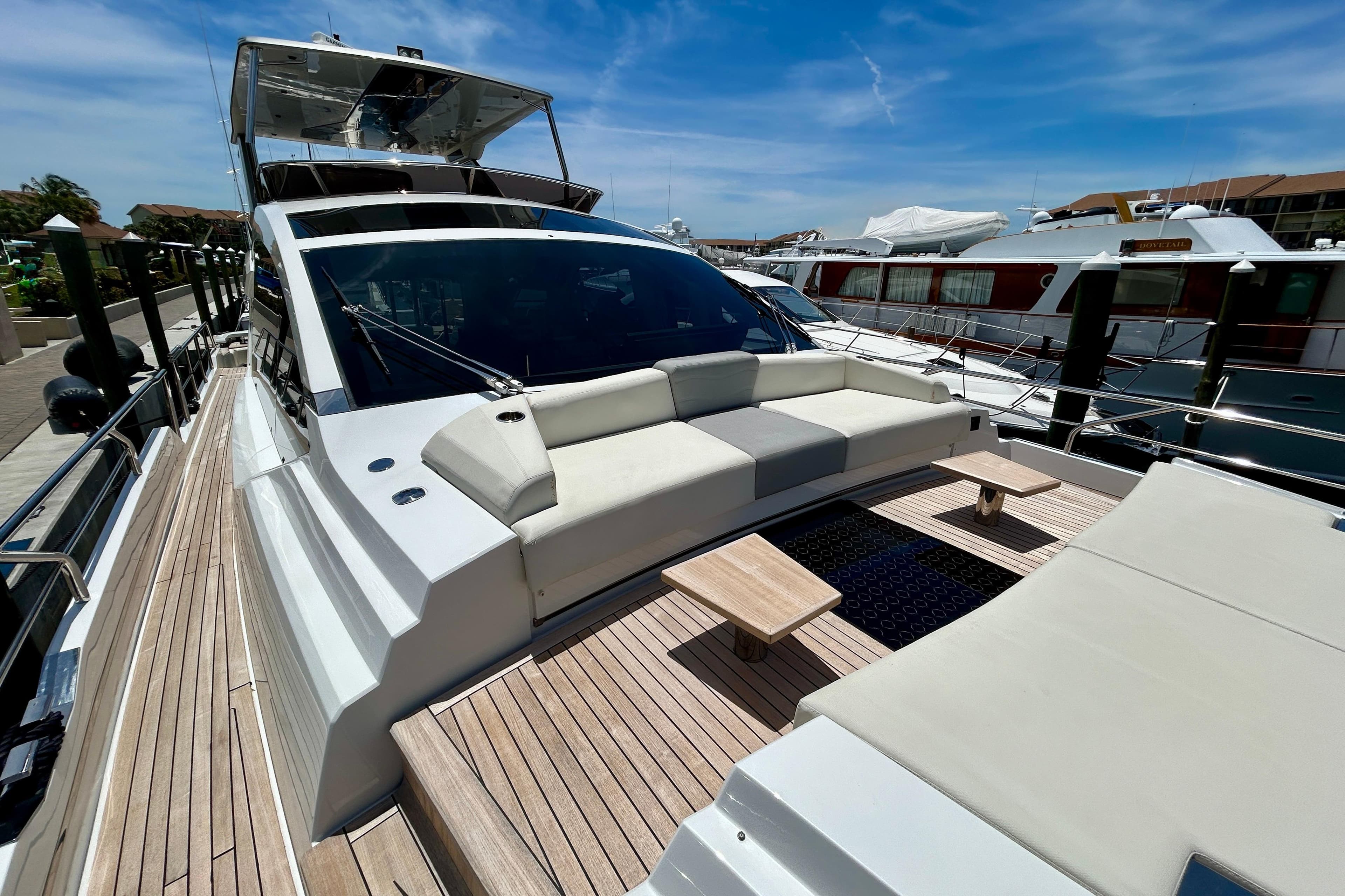 Luxurious 2024 Aicon Vivere 66 yacht with spacious deck and modern seating area.