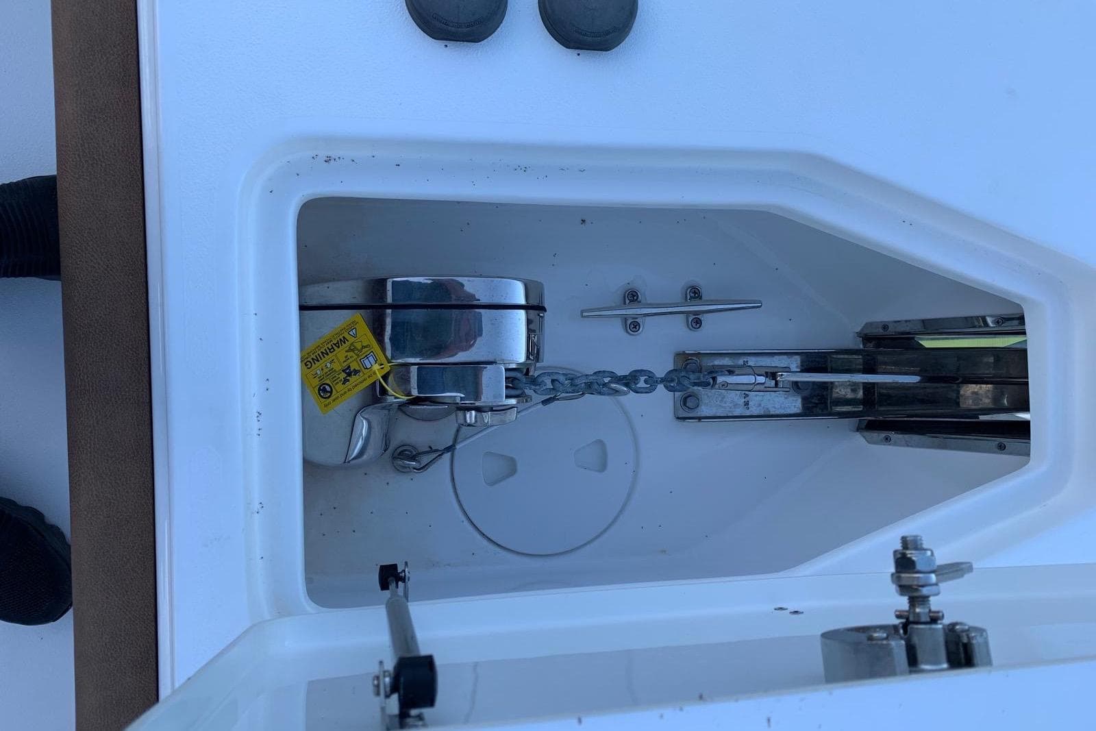 2022 Sea Hunt Gamefish 25 anchor compartment with chain and cleat.