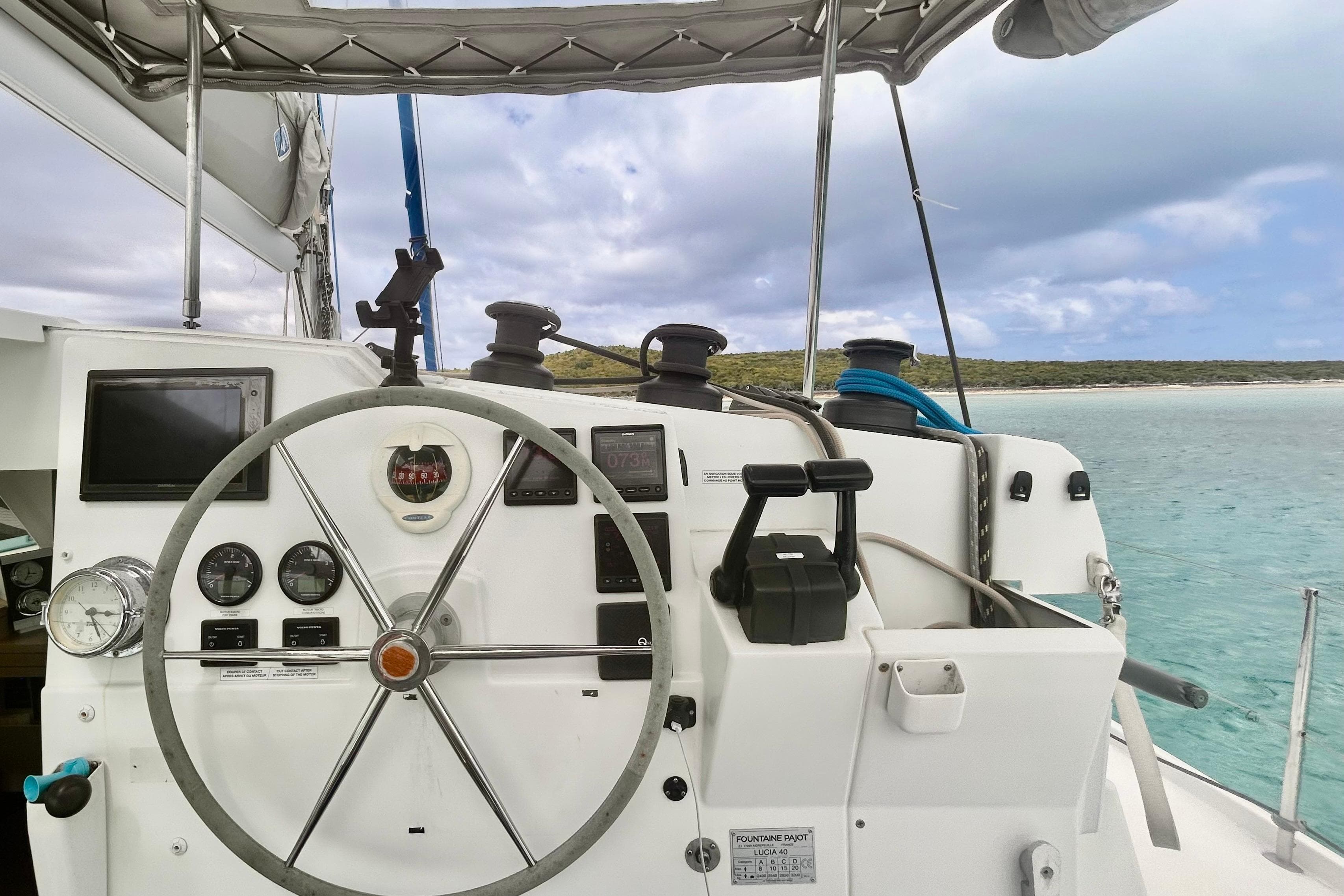 Helm of 2018 Fountaine Pajot Lucia 40 catamaran with ocean view.