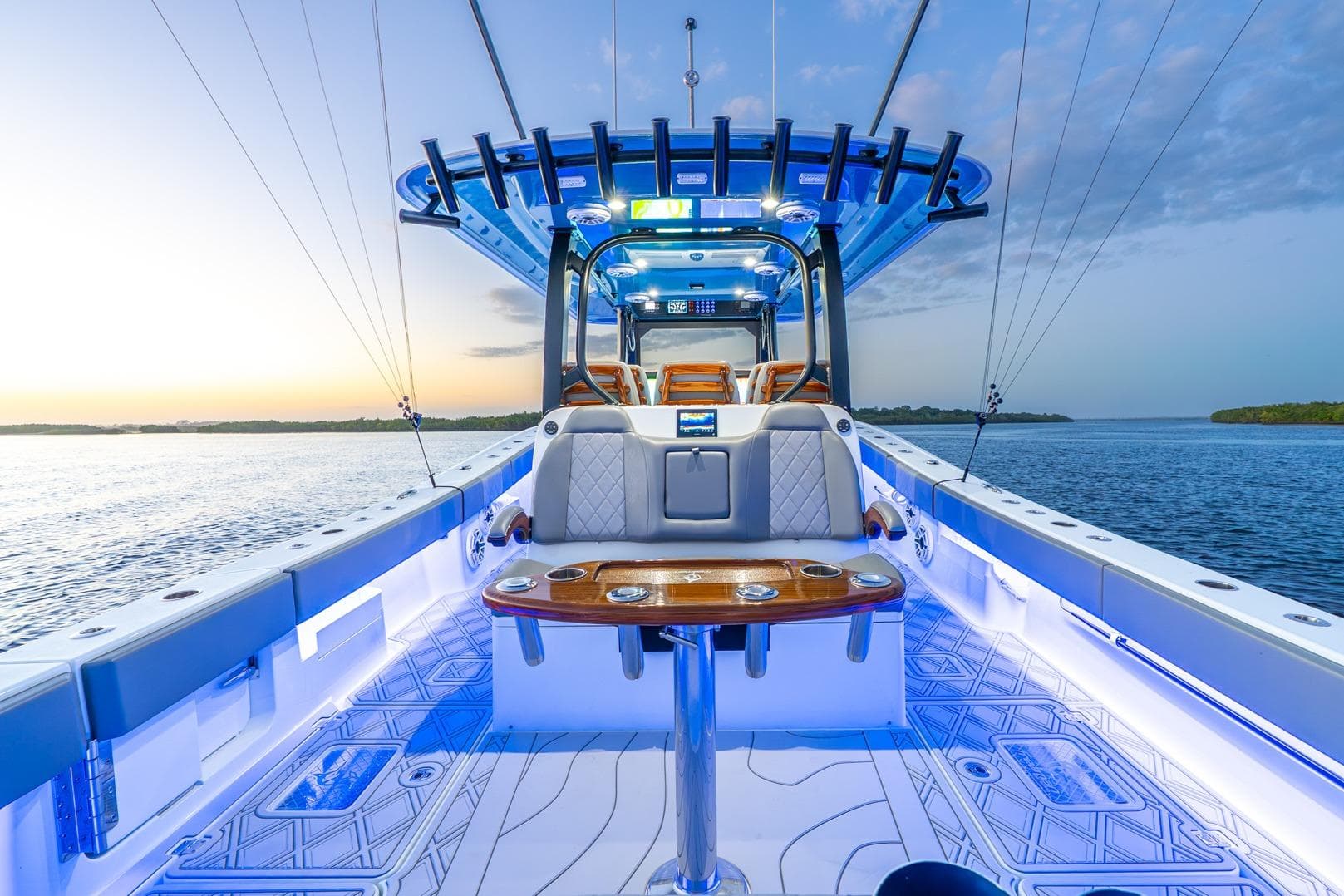 Luxurious 2025 Freeman 43 boat interior with modern design and ambient lighting on open water.