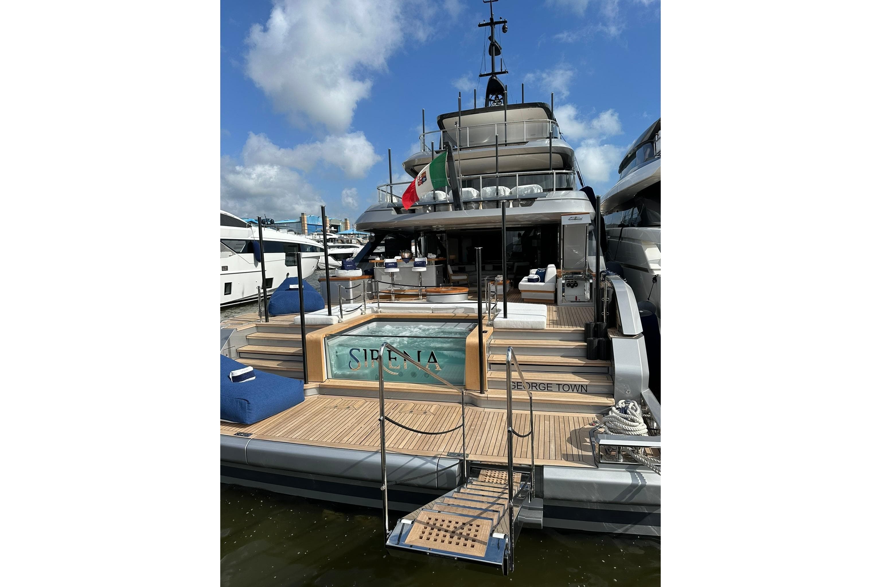 Luxury Benetti Oasis 34M yacht, 2024 model, docked with elegant deck and pool.