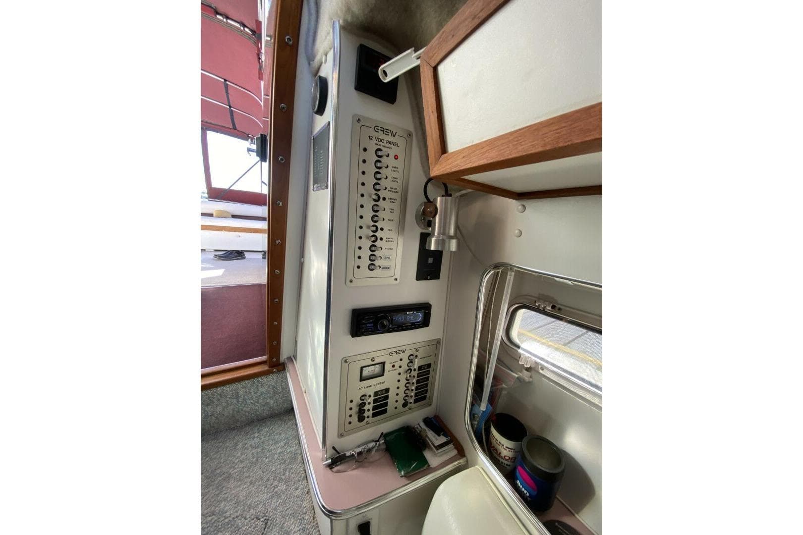 1988 Chris-Craft 332 Amerosport cabin interior with control panel and window view.