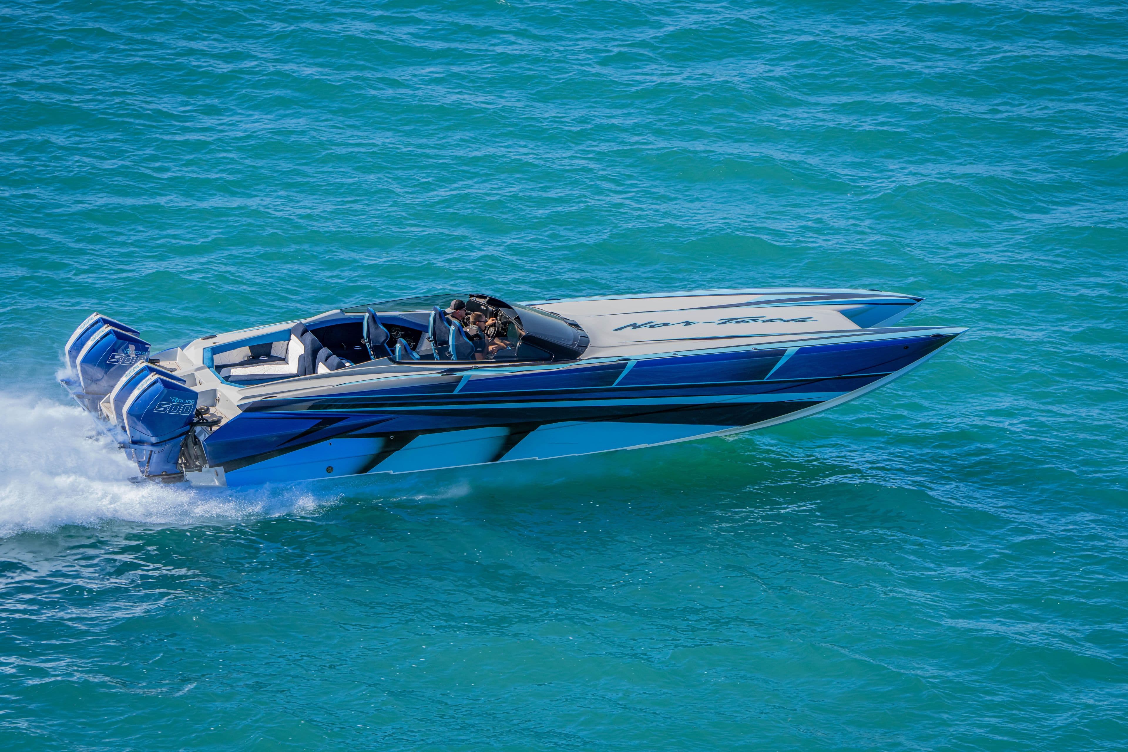 2026 Nor-Tech 4000 Super Catamaran speeding on blue ocean waters.