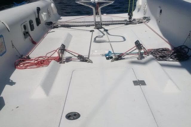 Sailboat deck of a 2001 Shock 40, featuring rigging and control lines.