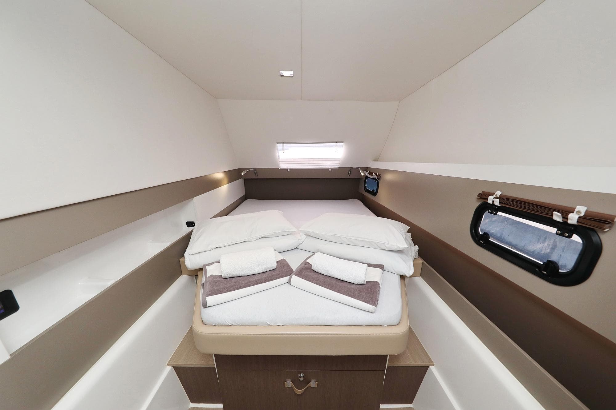 Interior cabin of 2020 Bali 4.3 MY yacht with neatly arranged bed linens.