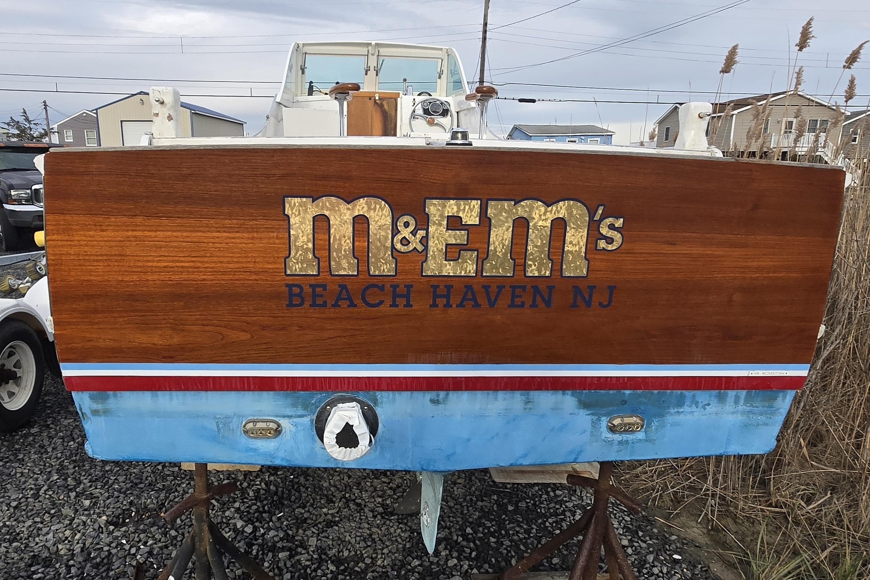 1964 Whiticar 24 boat with "M&M's Beach Haven NJ" on wooden transom.