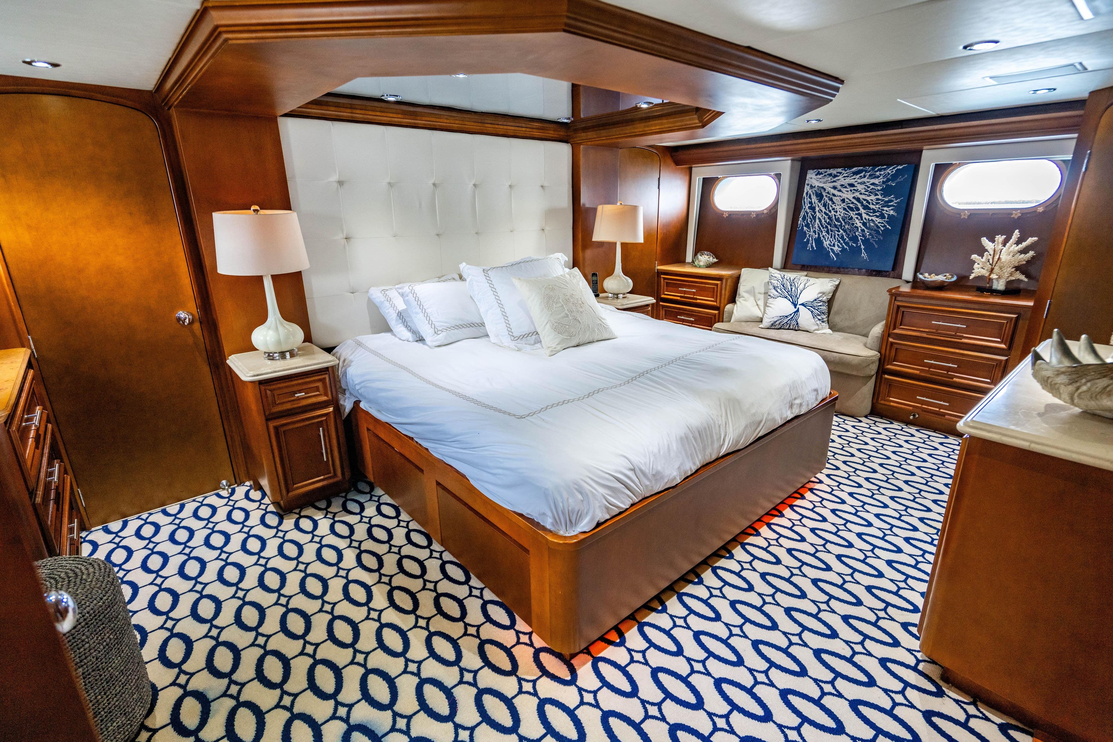 Luxurious 2006 Broward Raised Pilothouse yacht bedroom with elegant decor and nautical theme.