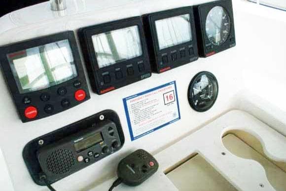 Control panel of a 1999 Hunter 380 sailboat with navigation instruments.