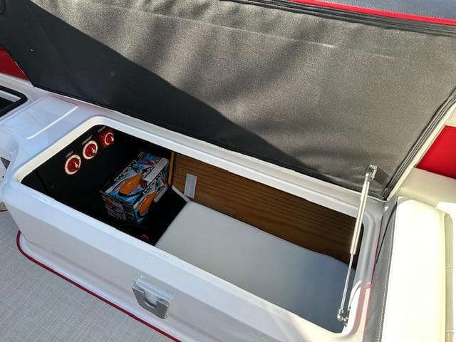 2025 Regal LS9 Surf boat storage compartment with open lid and interior view.