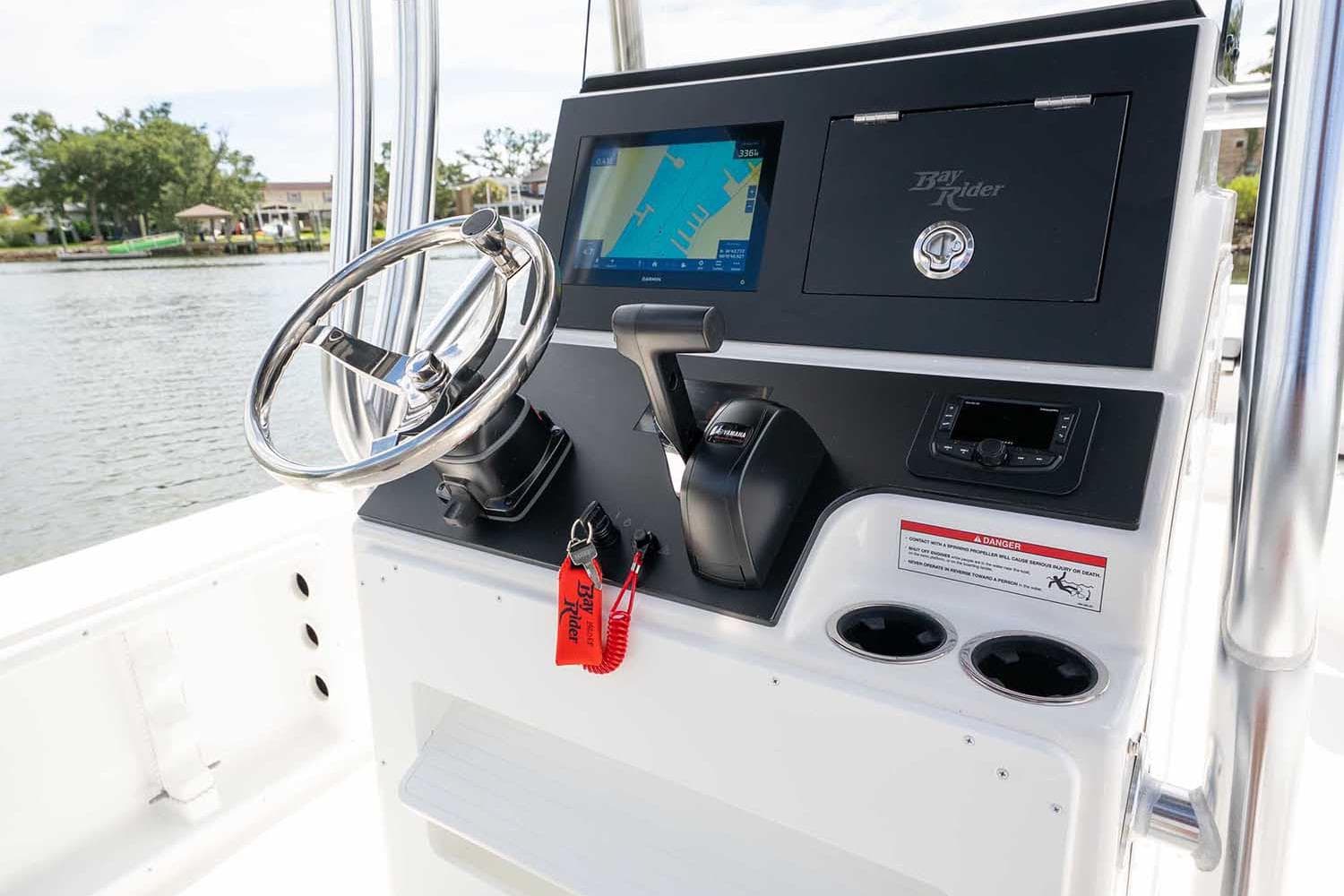 Manufacturer Provided Image: 2025 Bay Rider 2460 FS Skiff dashboard with steering wheel and navigation display.