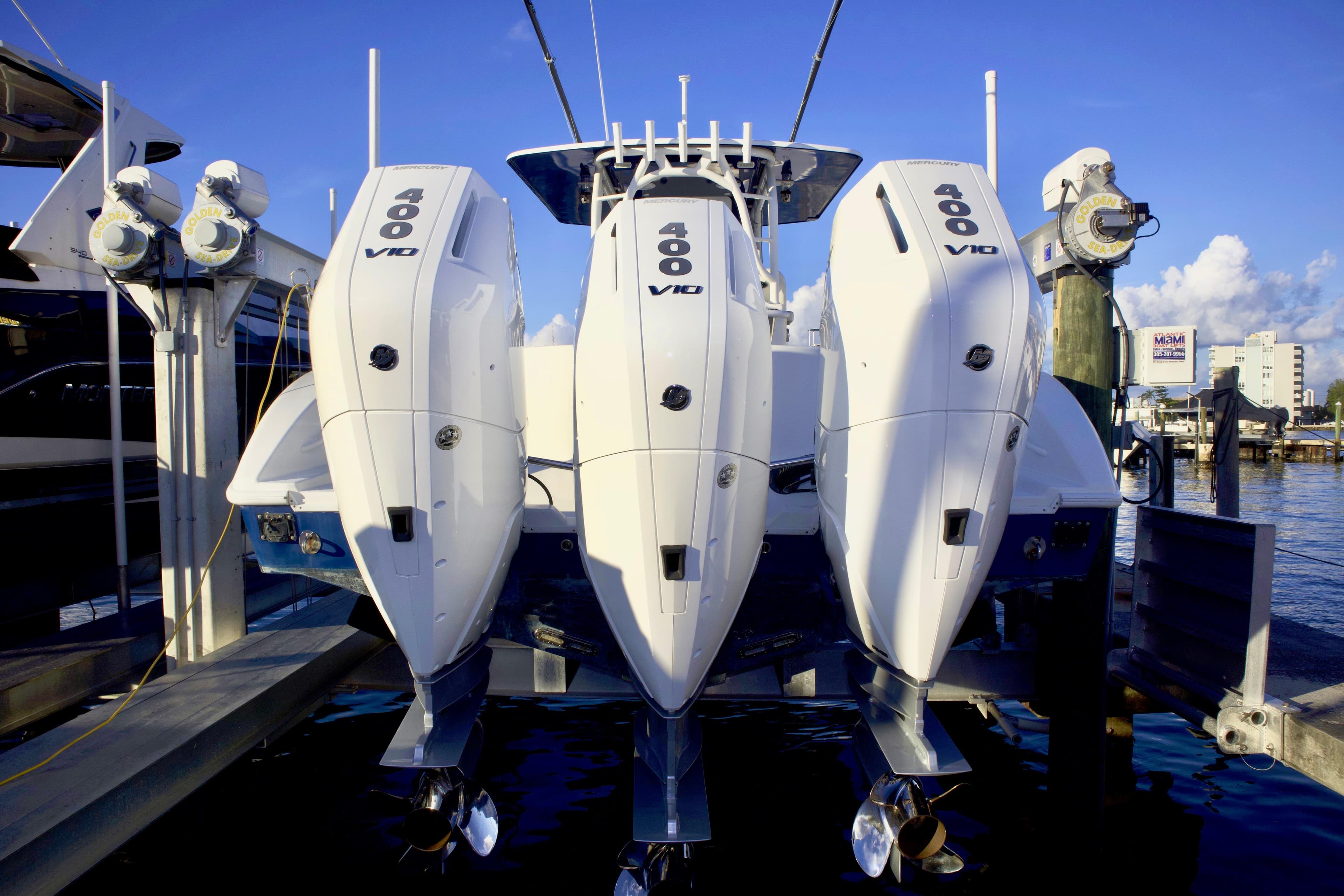 2017 Yellowfin 39 Offshore boat with triple 400 V10 engines docked at marina.