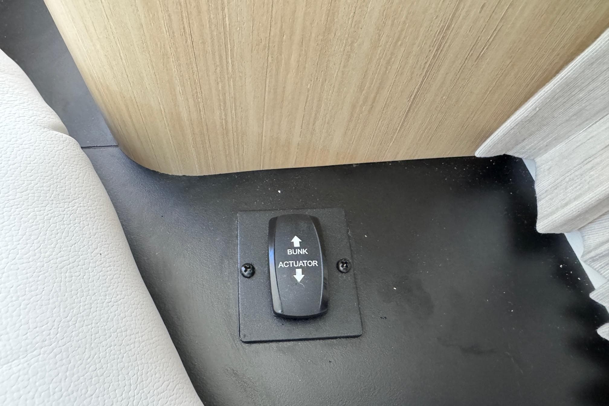 Bunk actuator switch in 2026 Regal 33 XO boat interior.